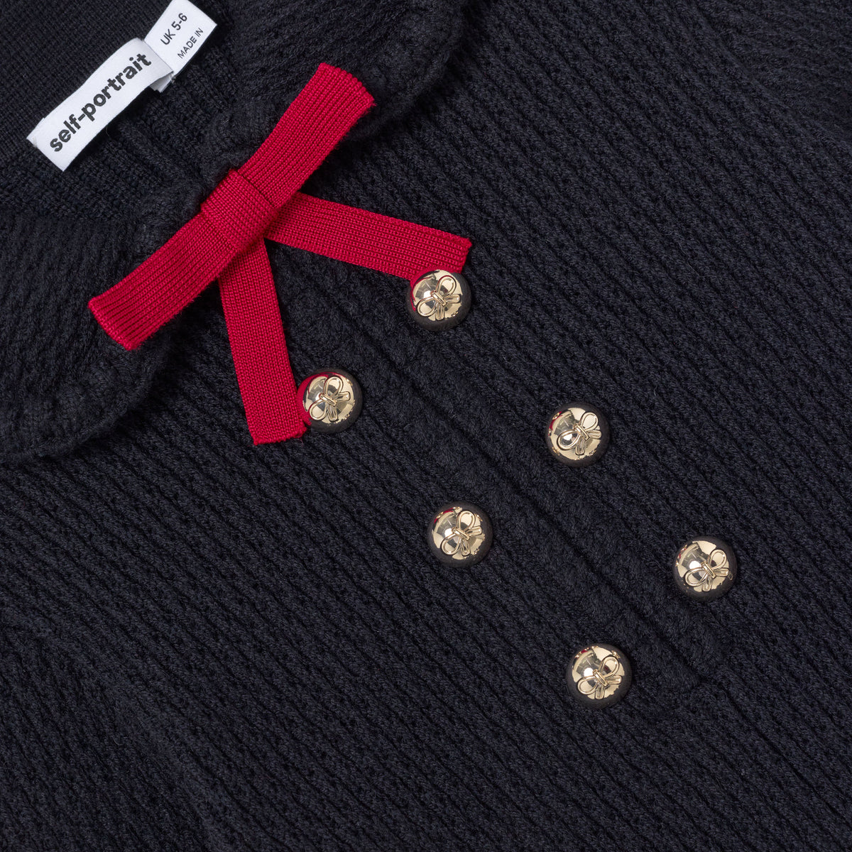 Detail Shot of the Navy Viscose Knit Bow Collar Dress