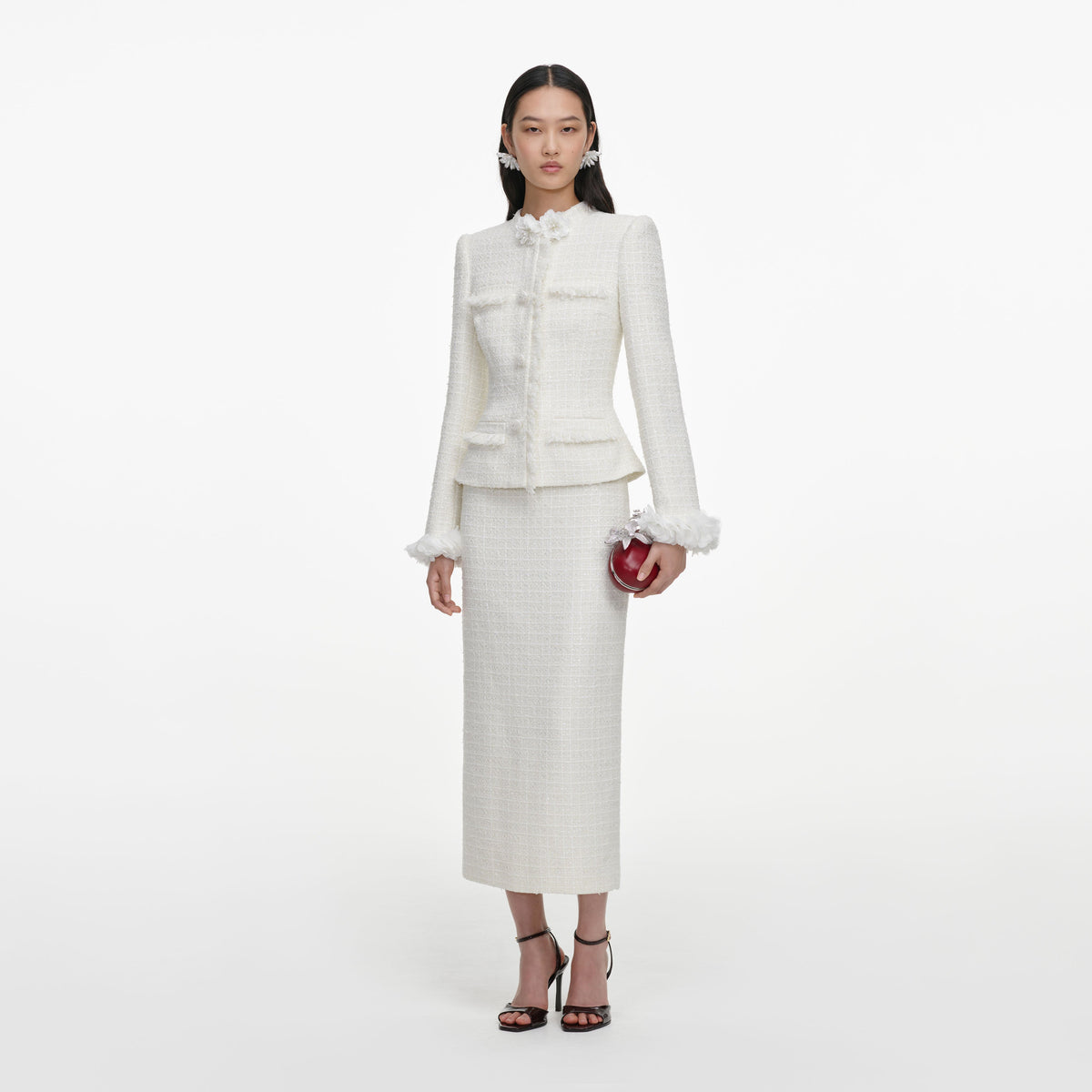 Side view of a woman wearing the Cream Boucle Flower Midi Dress
