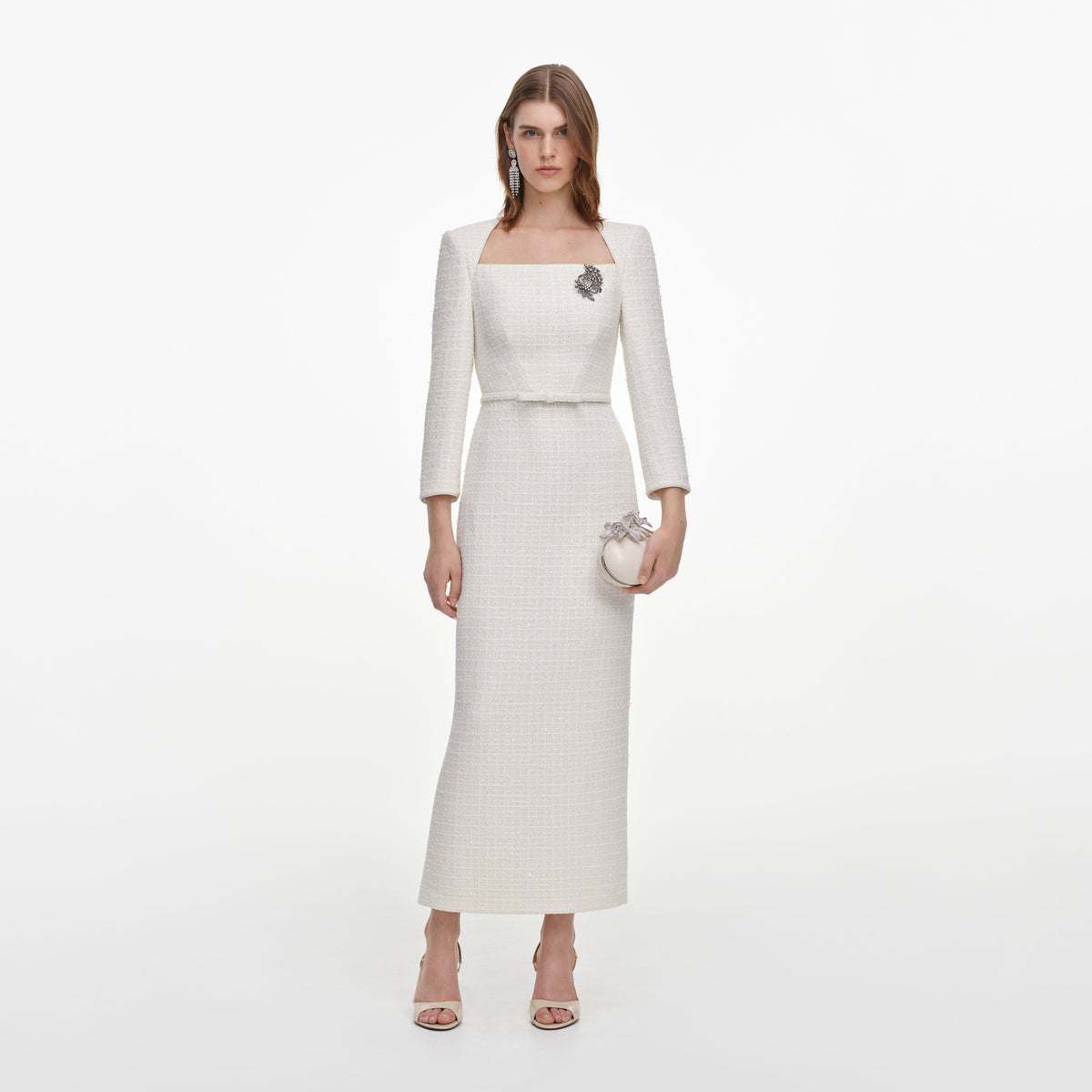 Front view of a woman wearing the Cream Tailored Boucle Brooch Midi Dress