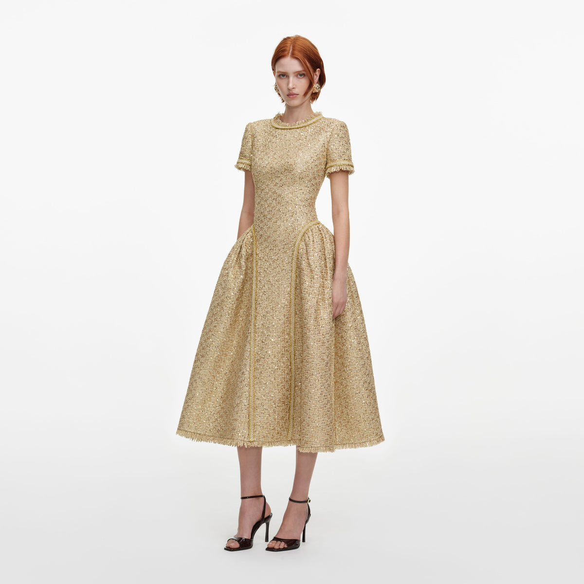Side view of a woman wearing the Gold Sequin Boucle Midi Dress
