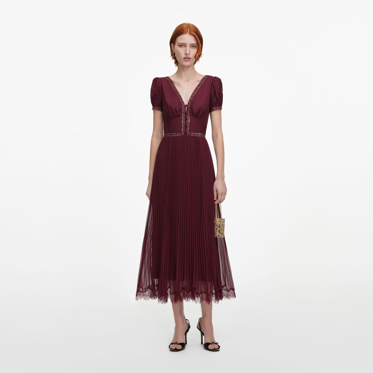 Front view of a woman wearing the Burgundy Viscose Pleated Lace Midi Dress