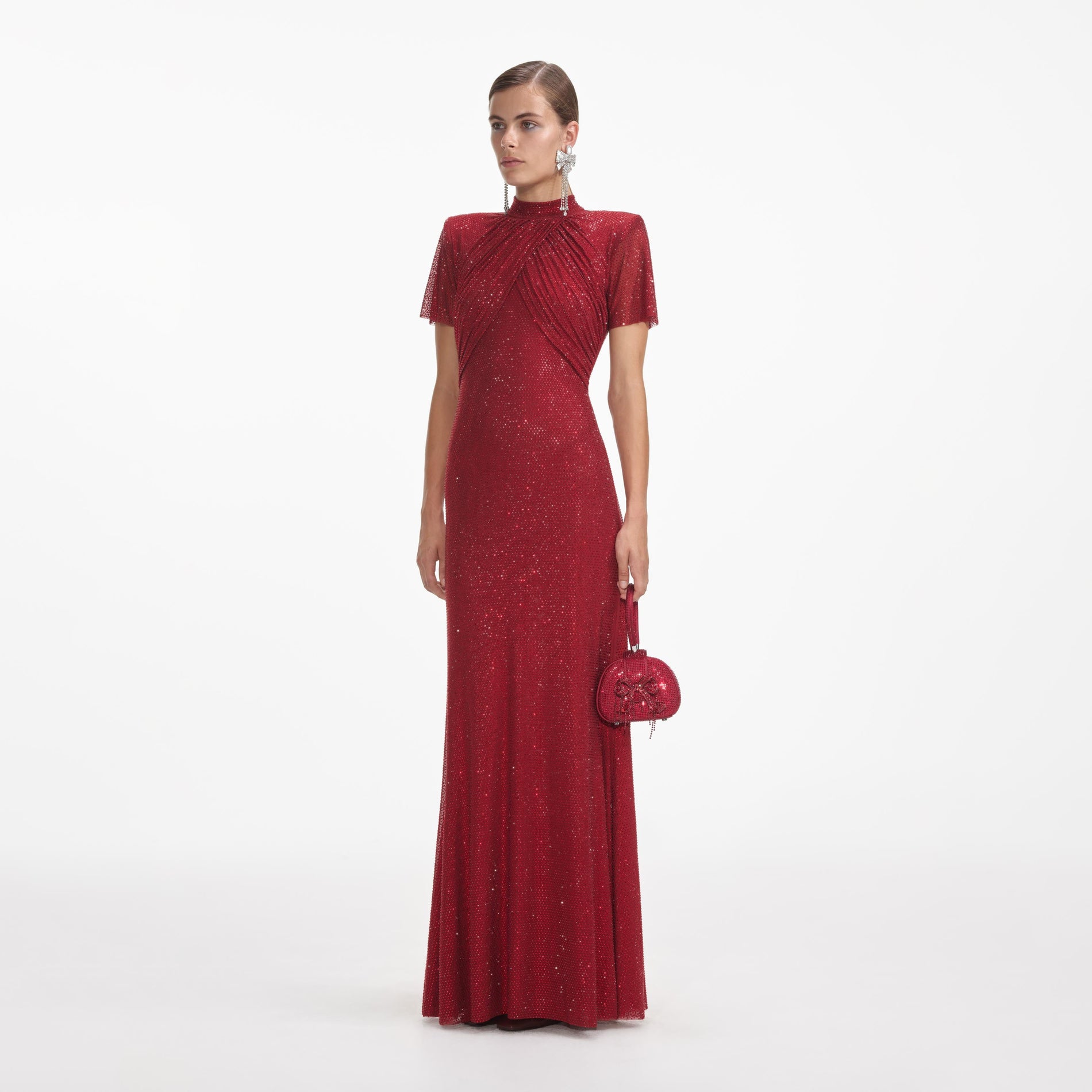 Side view of a woman wearing the Red Rhinestone Mesh Maxi Dress