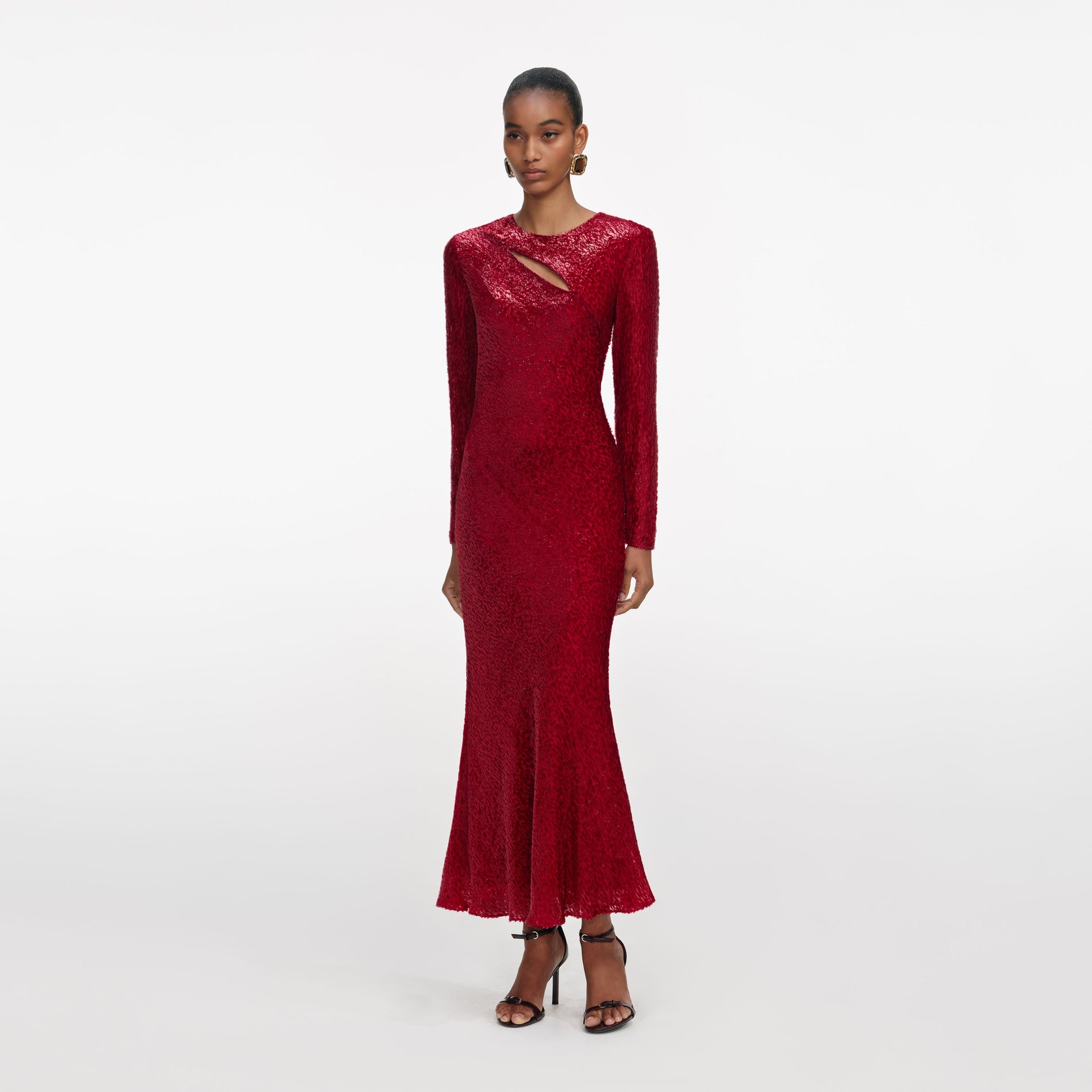 Side view of a woman wearing the Red Fil Coupe Midi Dress