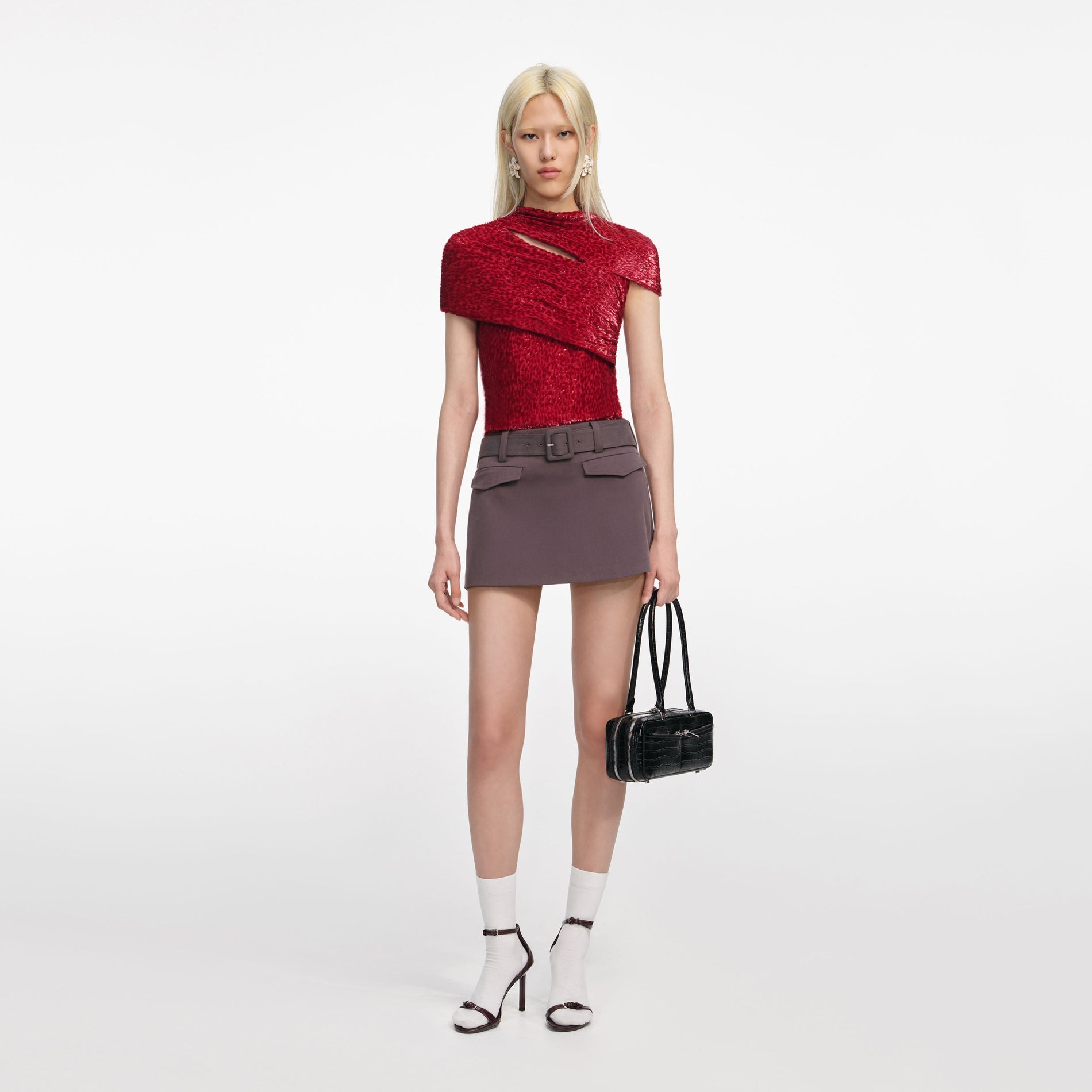 Front view of a woman wearing the Red Fil Coupe Cut Out Top