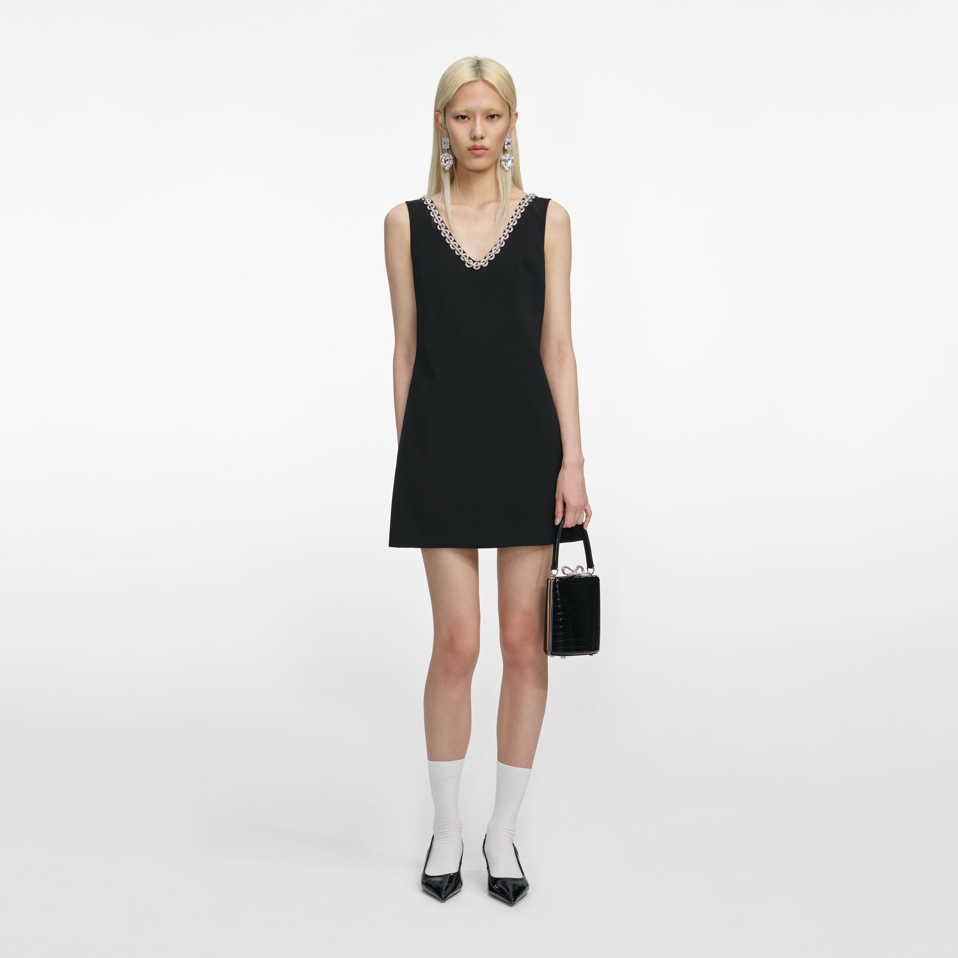 Front view of a woman wearing the Black Crepe Crystal Trim Mini Dress