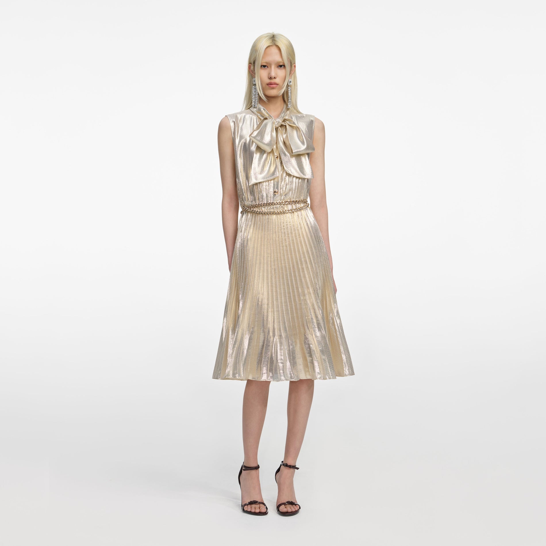 Front view of a woman wearing the Gold Metallic Sleeveless Midi Dress
