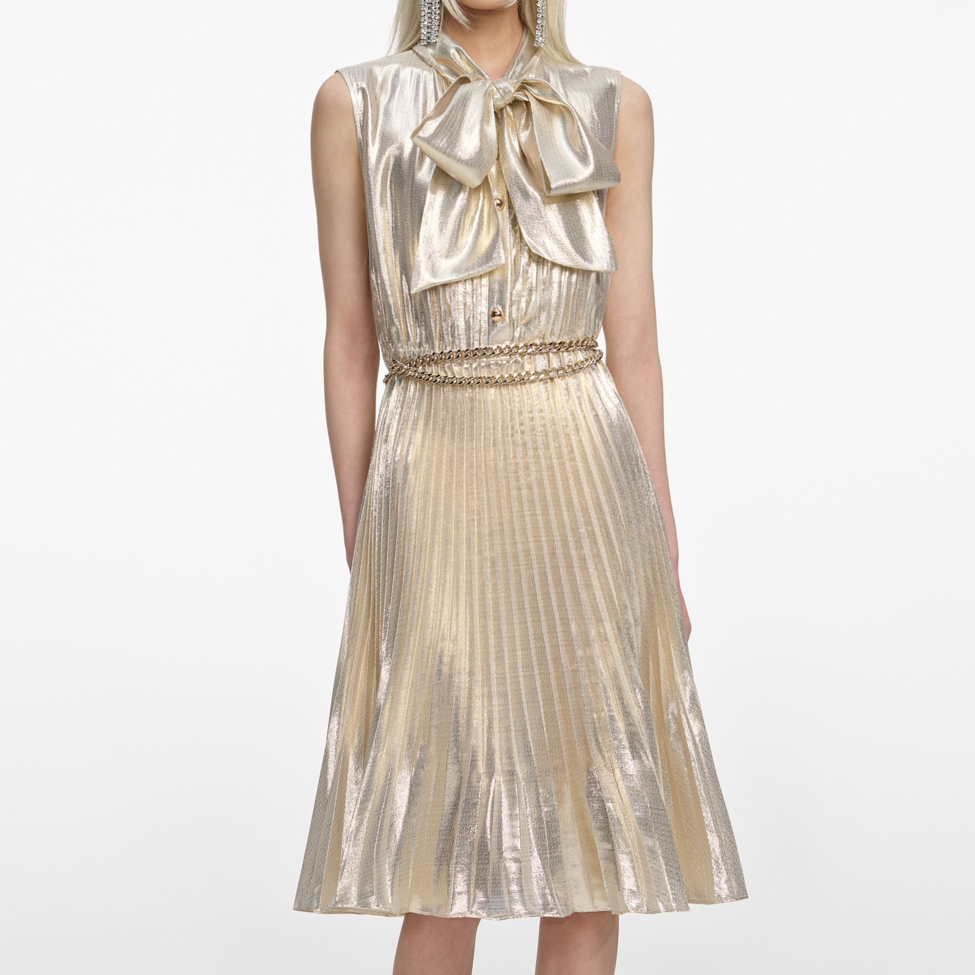 A close up of a woman wearing the Gold Metallic Sleeveless Midi Dress