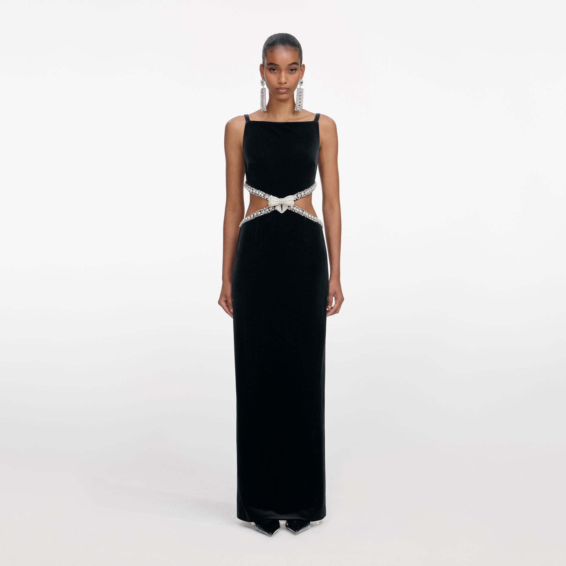 Front view of a woman wearing the Black Velvet Cut Out Maxi Dress