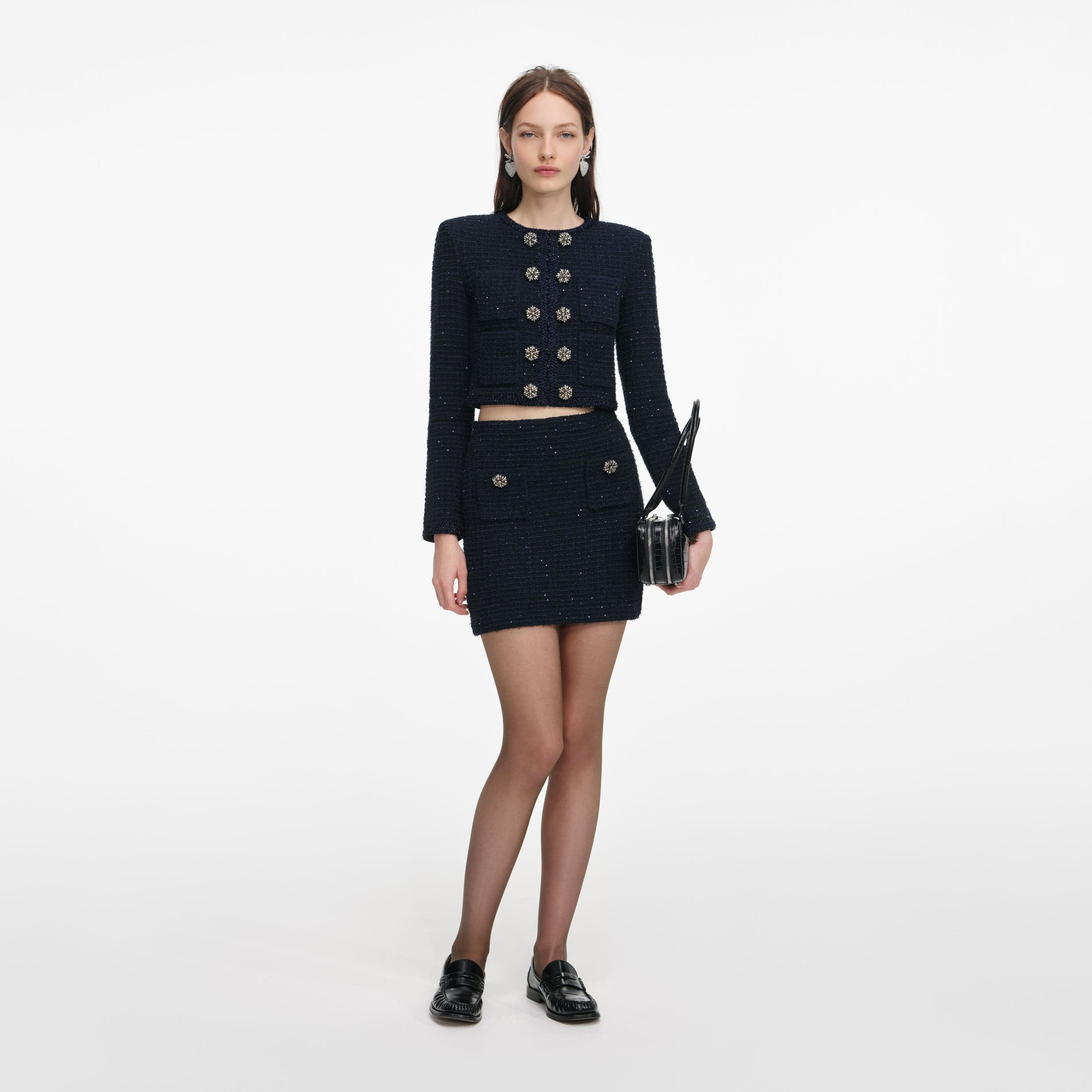 Front view of a woman wearing the Navy Textured Knit Cardigan