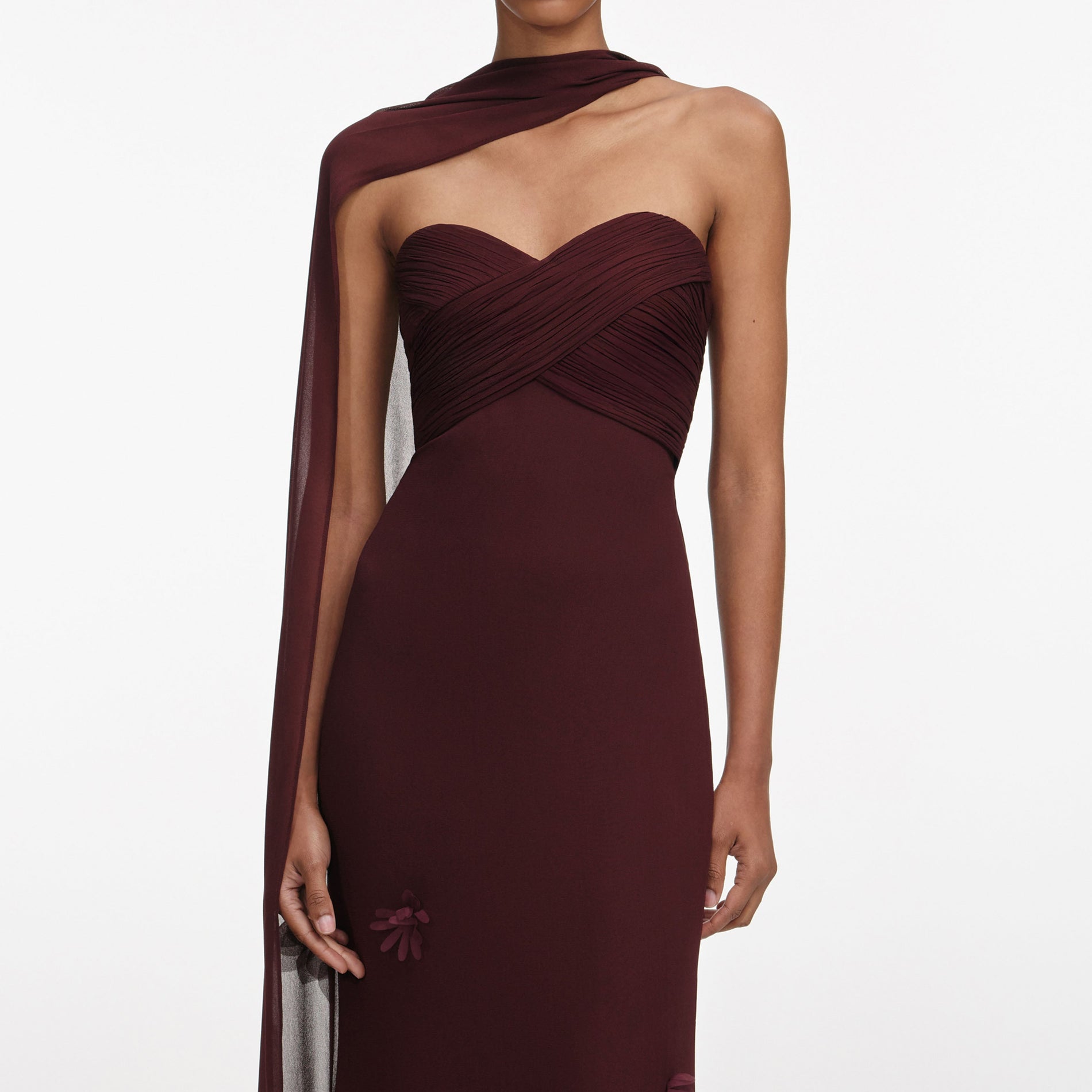 A close up of a woman wearing the Brown Georgette Flower Maxi Dress