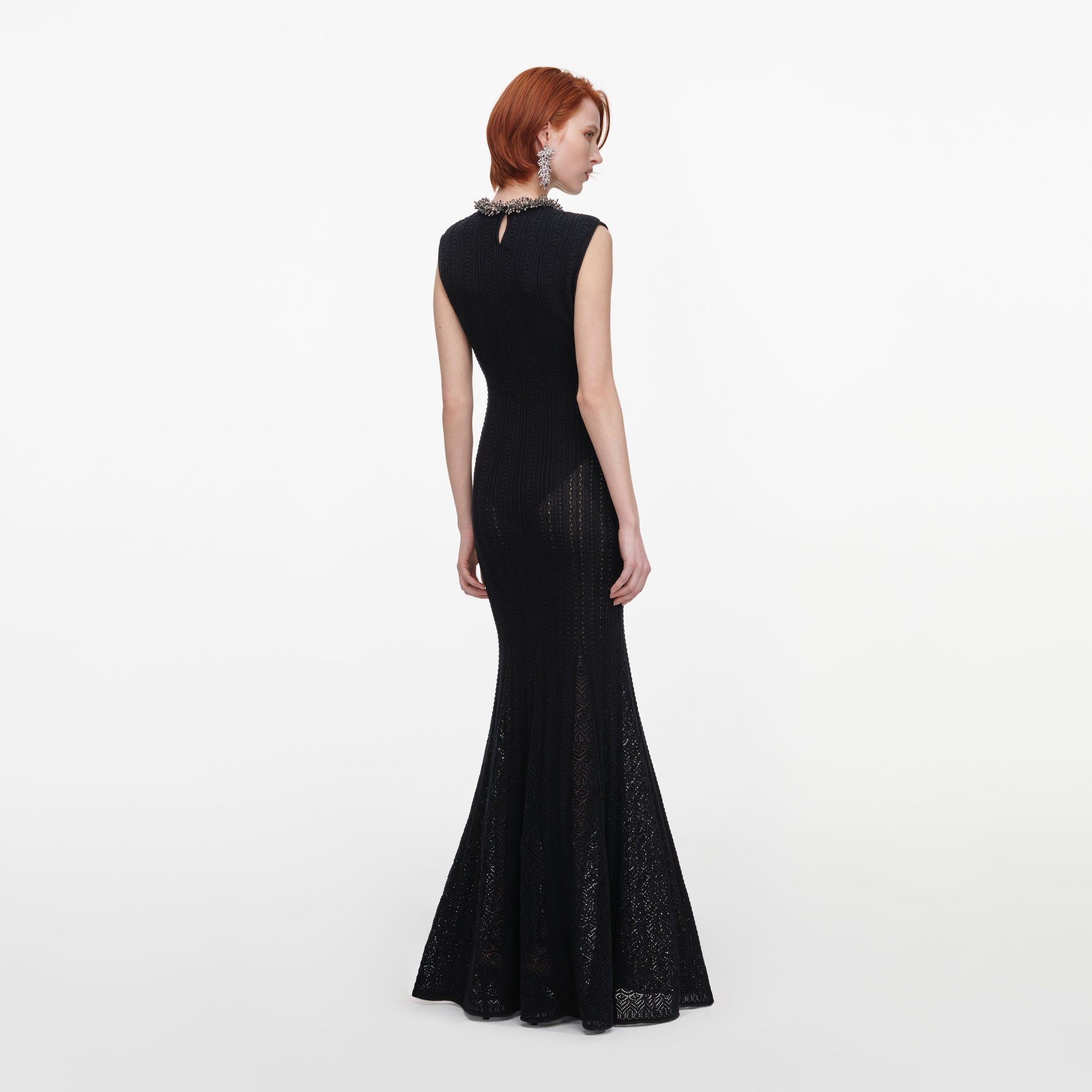 Back view of a woman wearing the Black Beaded Pointelle Knit Maxi Dress