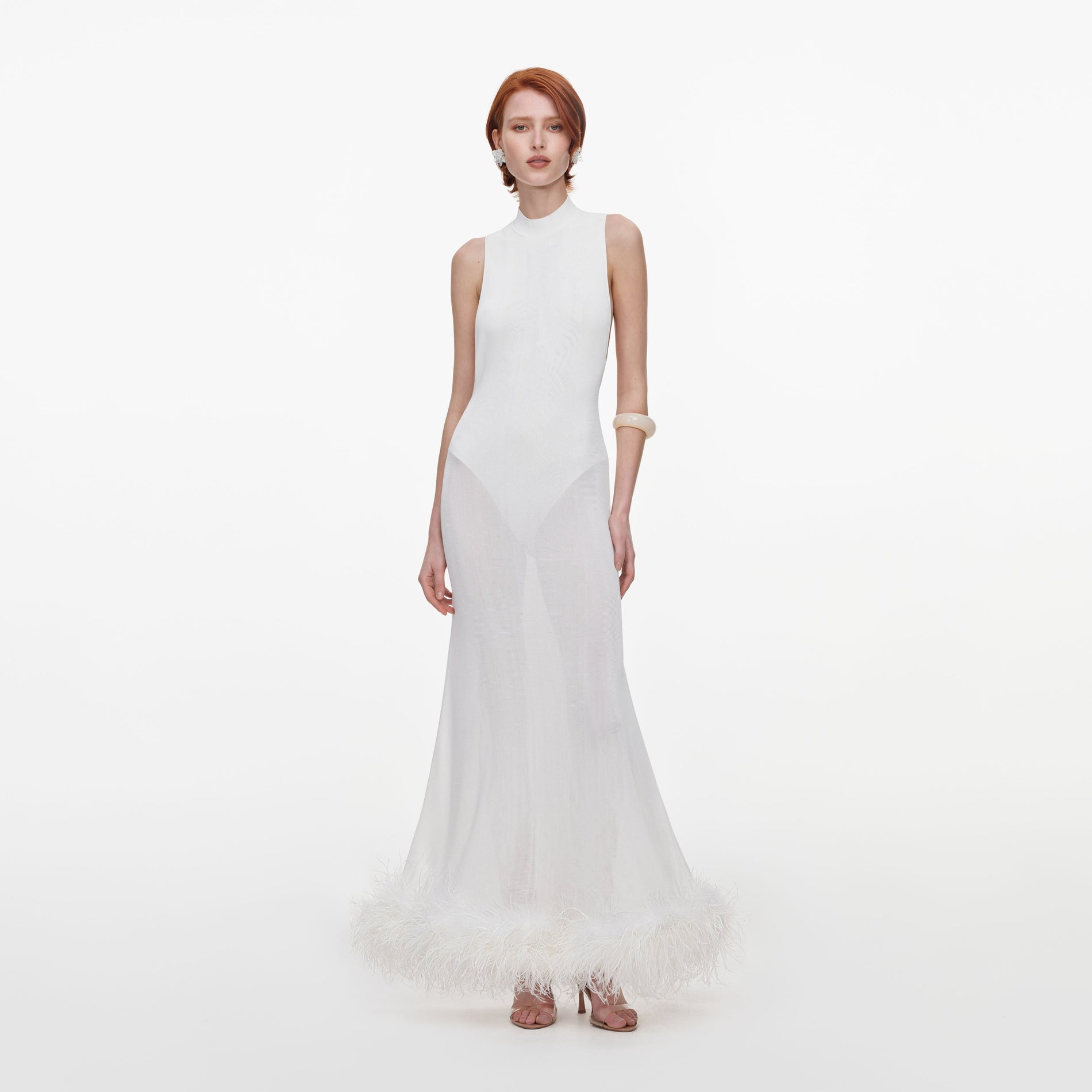 Front view of a woman wearing the White Racer Back Feather Knit Midi Dress