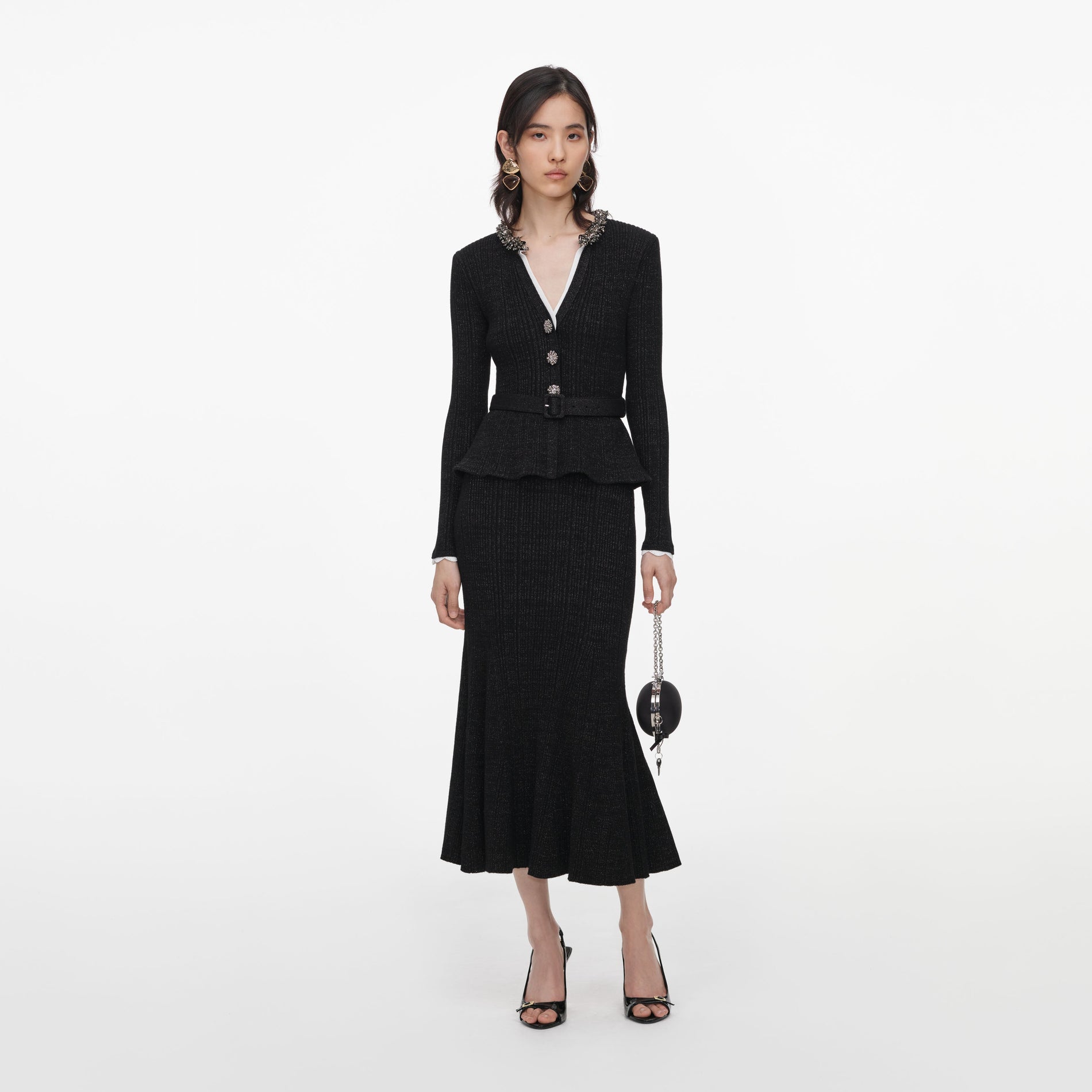 Front view of a woman wearing the Black Lurex Rib Knit Midi Dress
