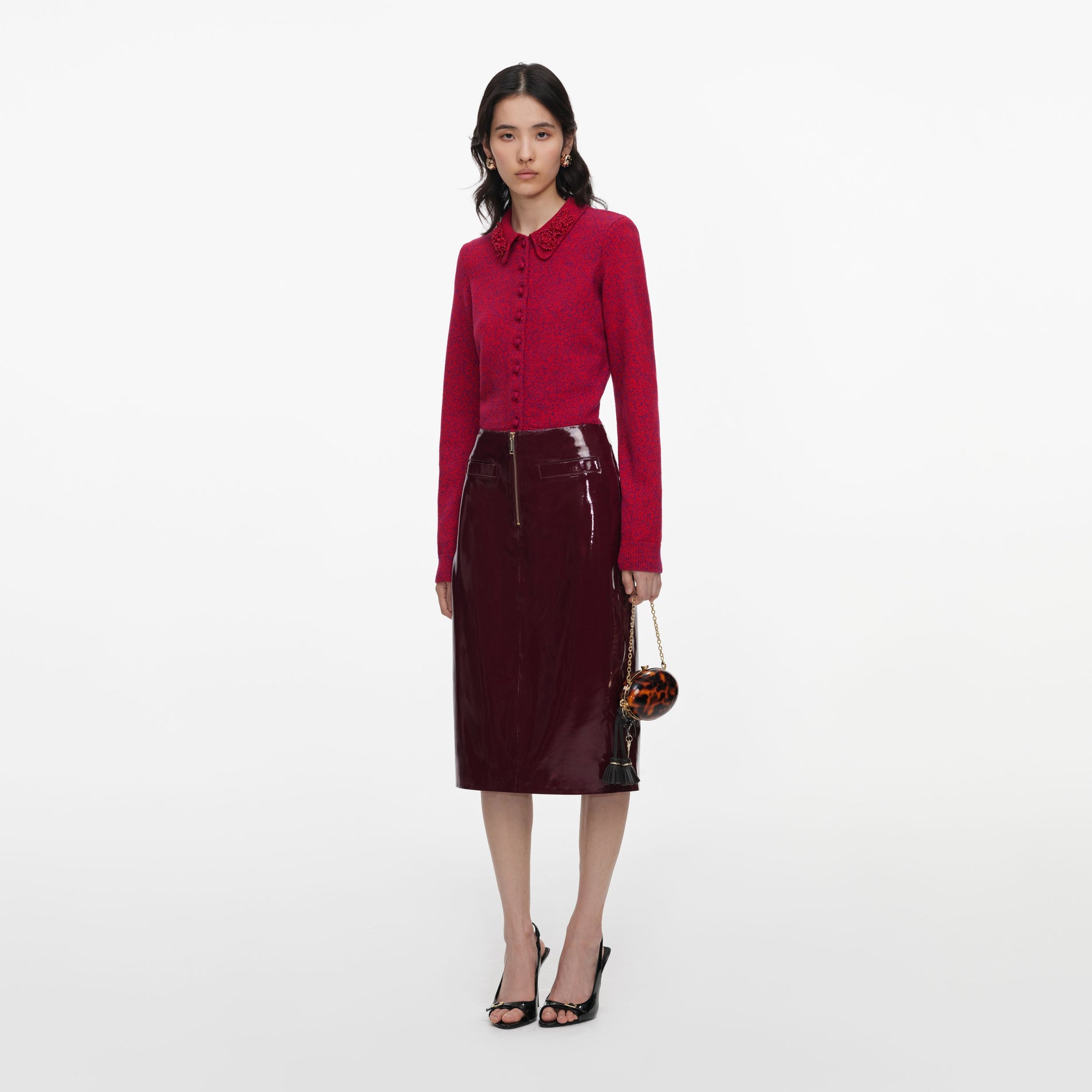 Side view of a woman wearing the Red Flower Knit Cardigan