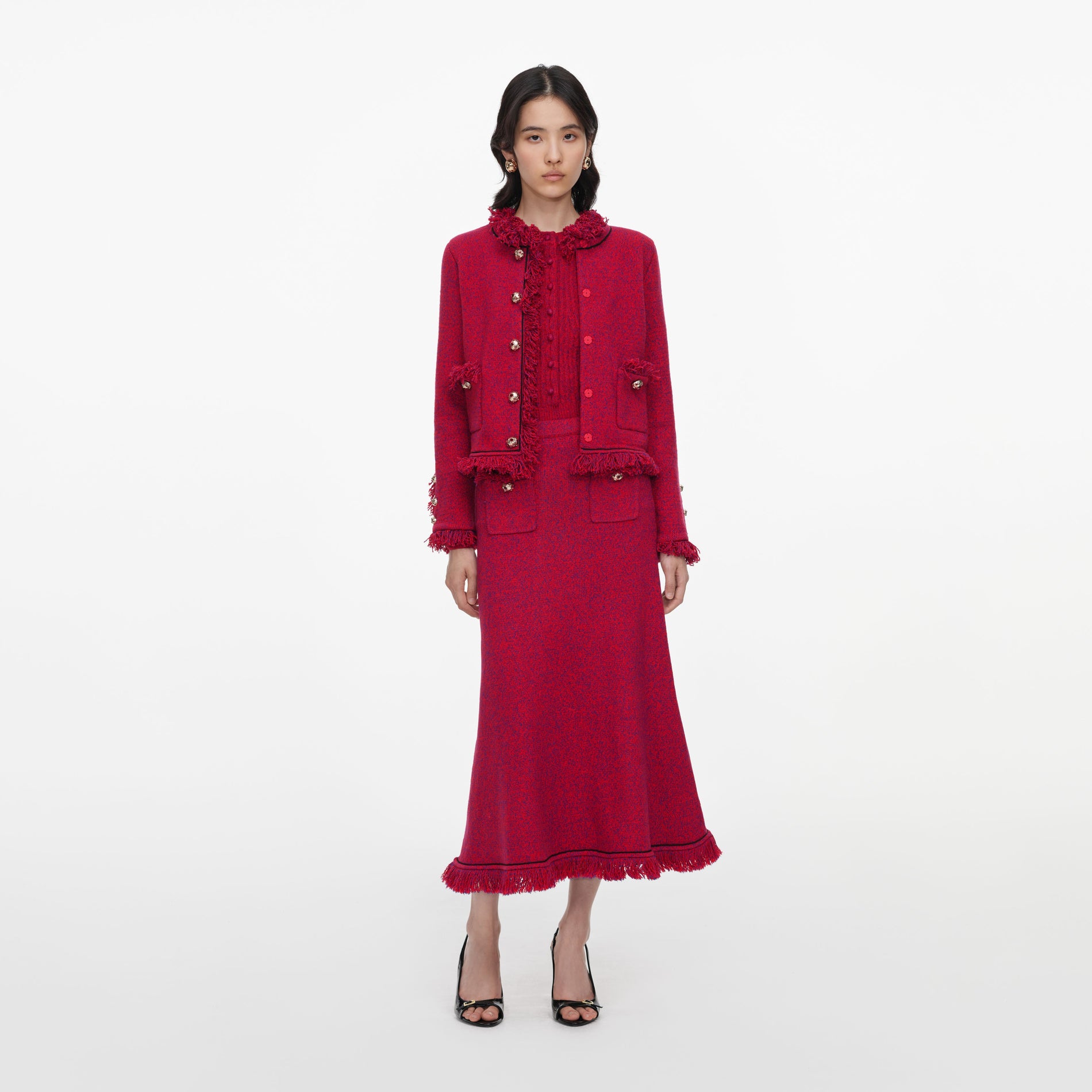 Front view of a woman wearing the Red Frayed Knit Midi Skirt