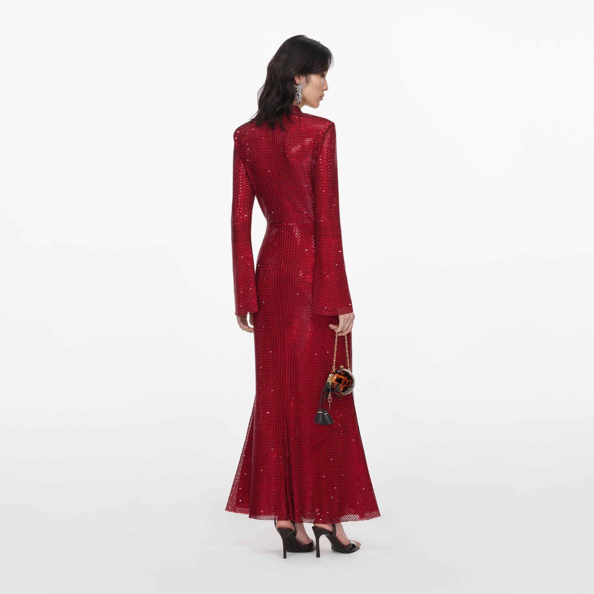 Back view of a woman wearing the Red Rhinestone Mesh Twist Midi Dress