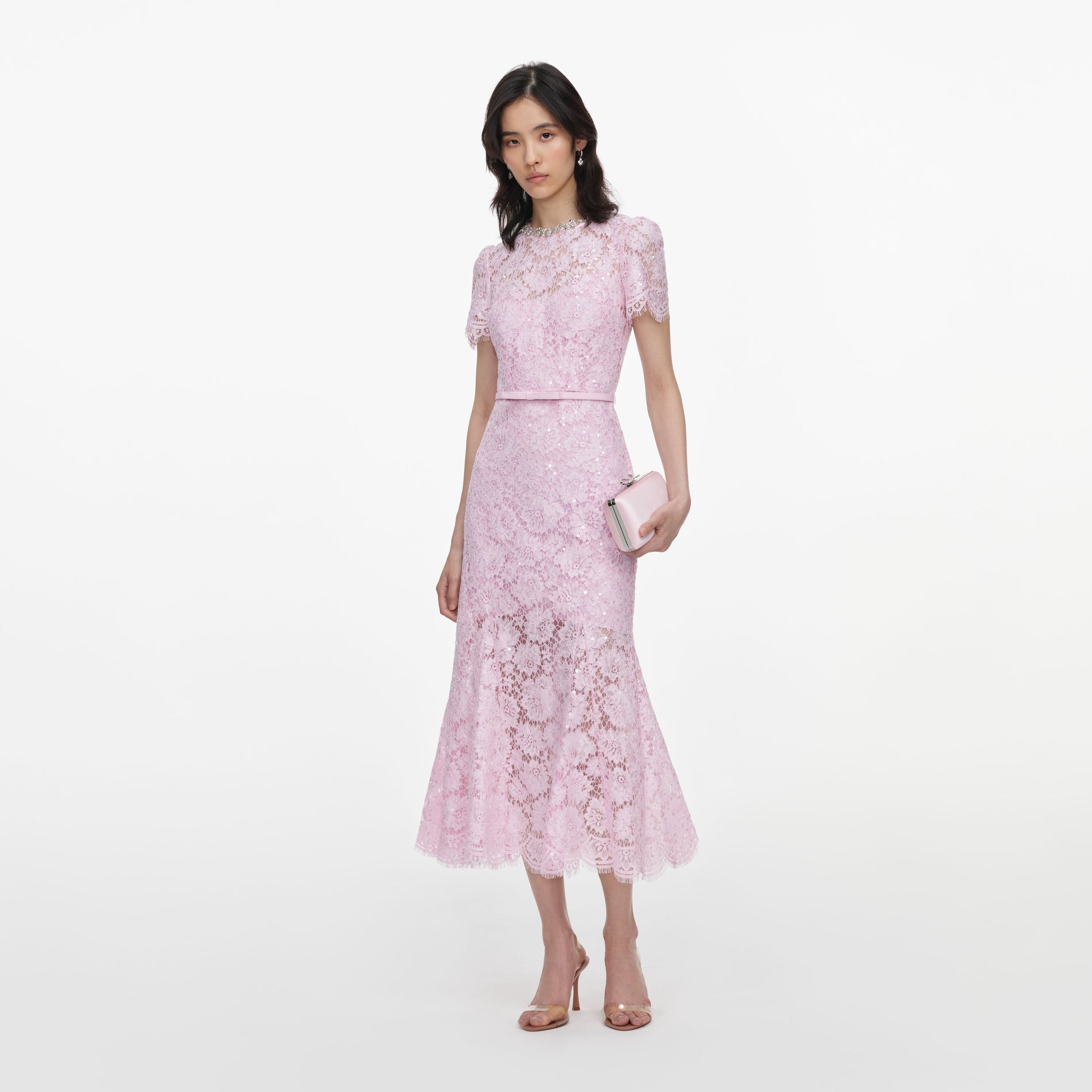 Side view of a woman wearing the Pink Sequin Lace Midi Dress