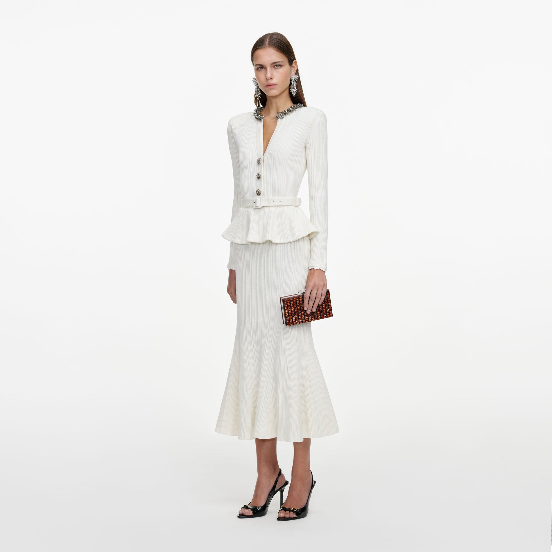 Side view of a woman wearing the Cream Lurex Rib Knit Midi Dress
