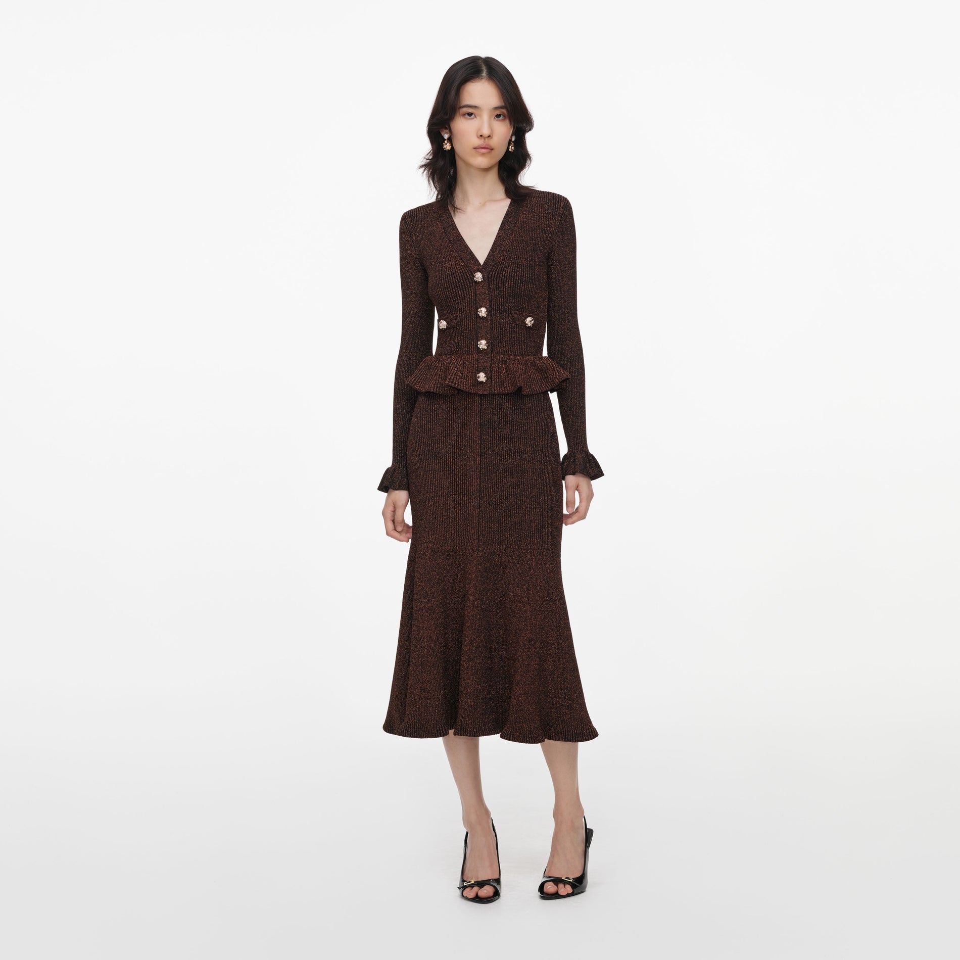 Front view of a woman wearing the Brown Lurex Peplum Knit Midi Dress