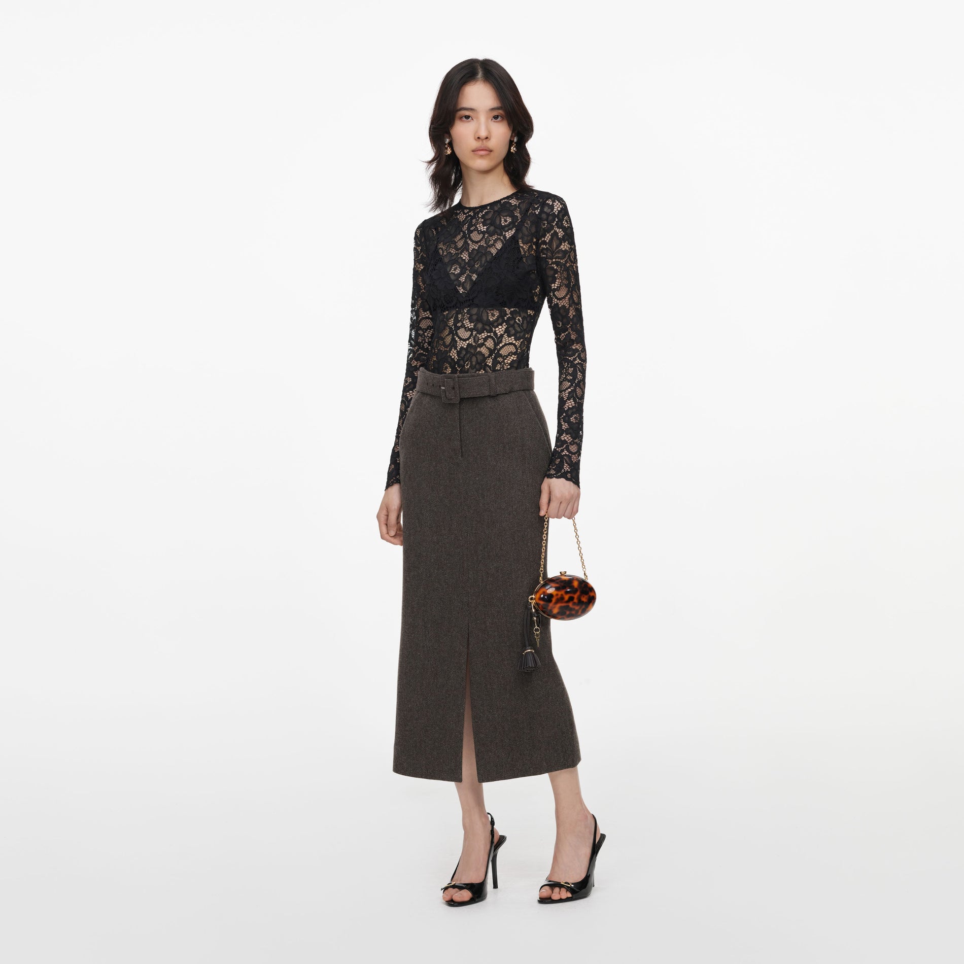 Side view of a woman wearing the Brown Wool Midi Skirt