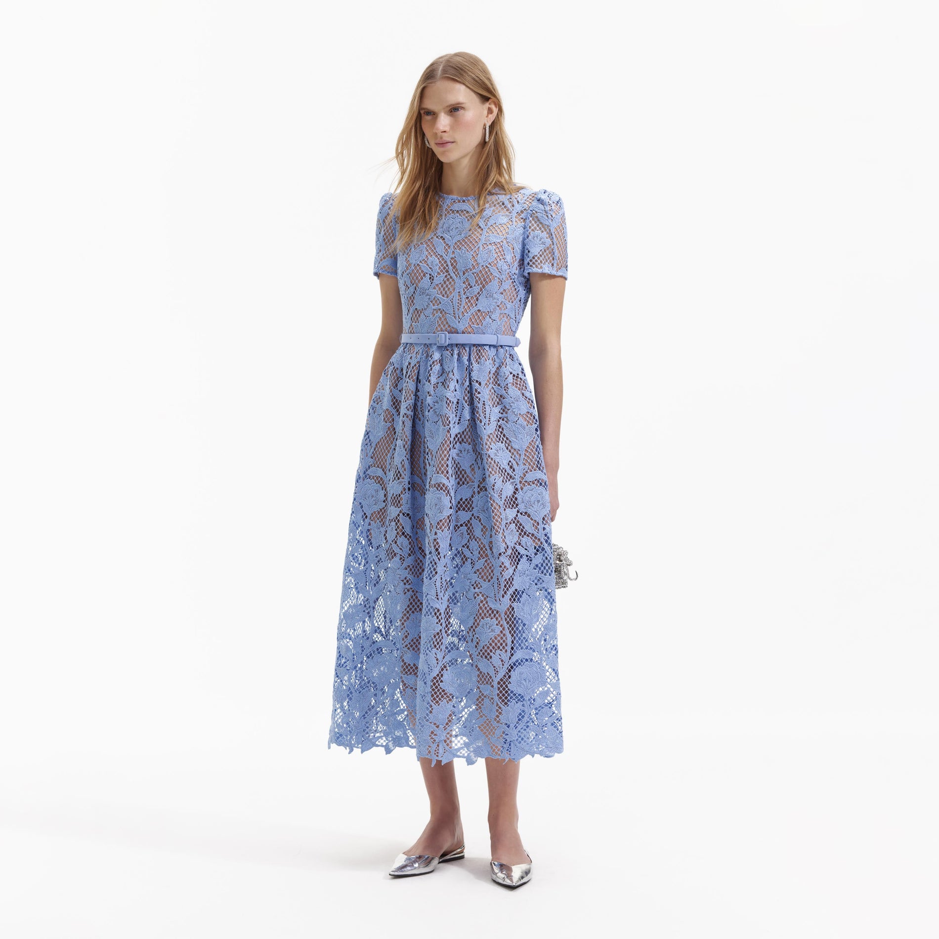Side view of a woman wearing the Blue Lily Lace Midi Dress