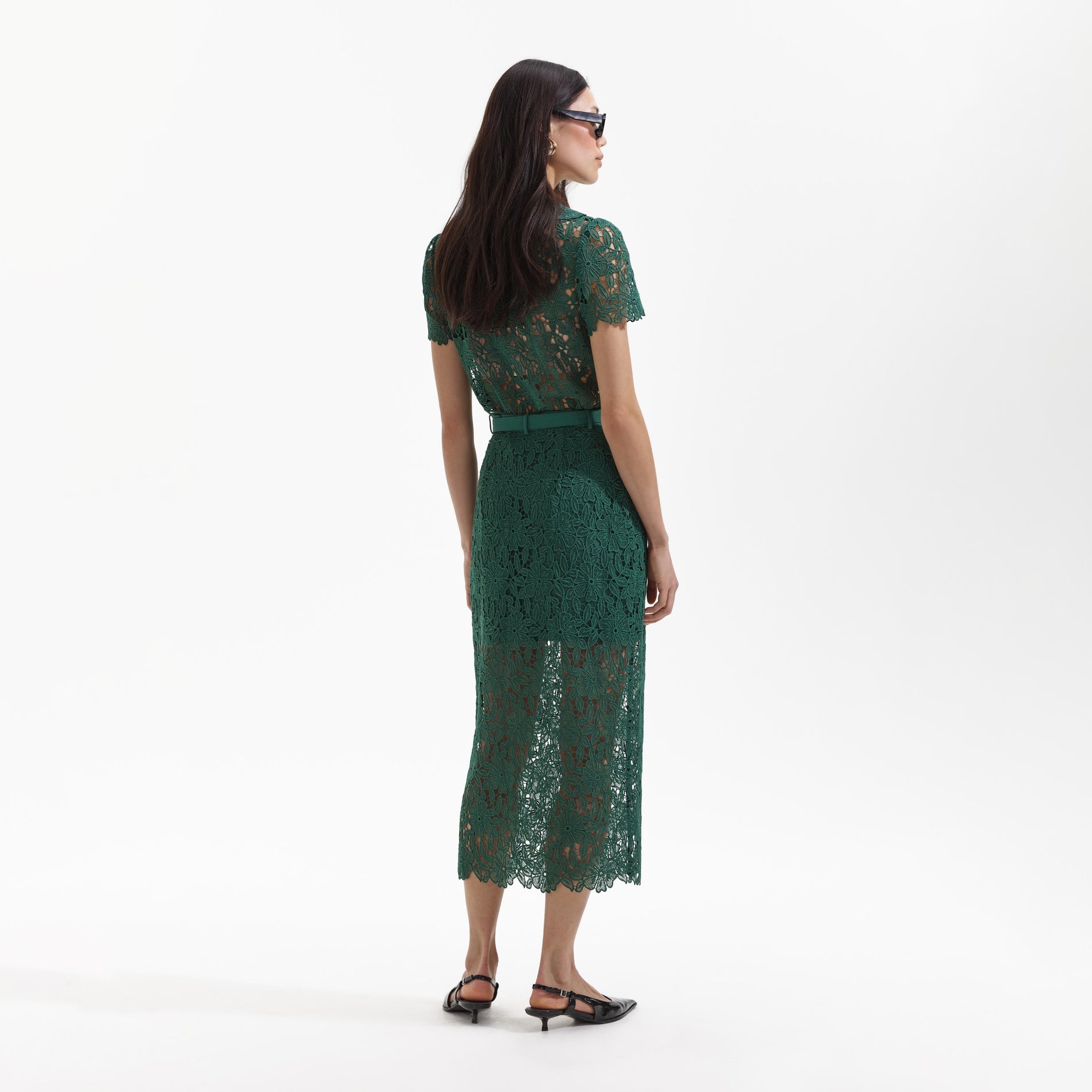 Back view of a woman wearing the Green Guipure Lace Midi Skirt