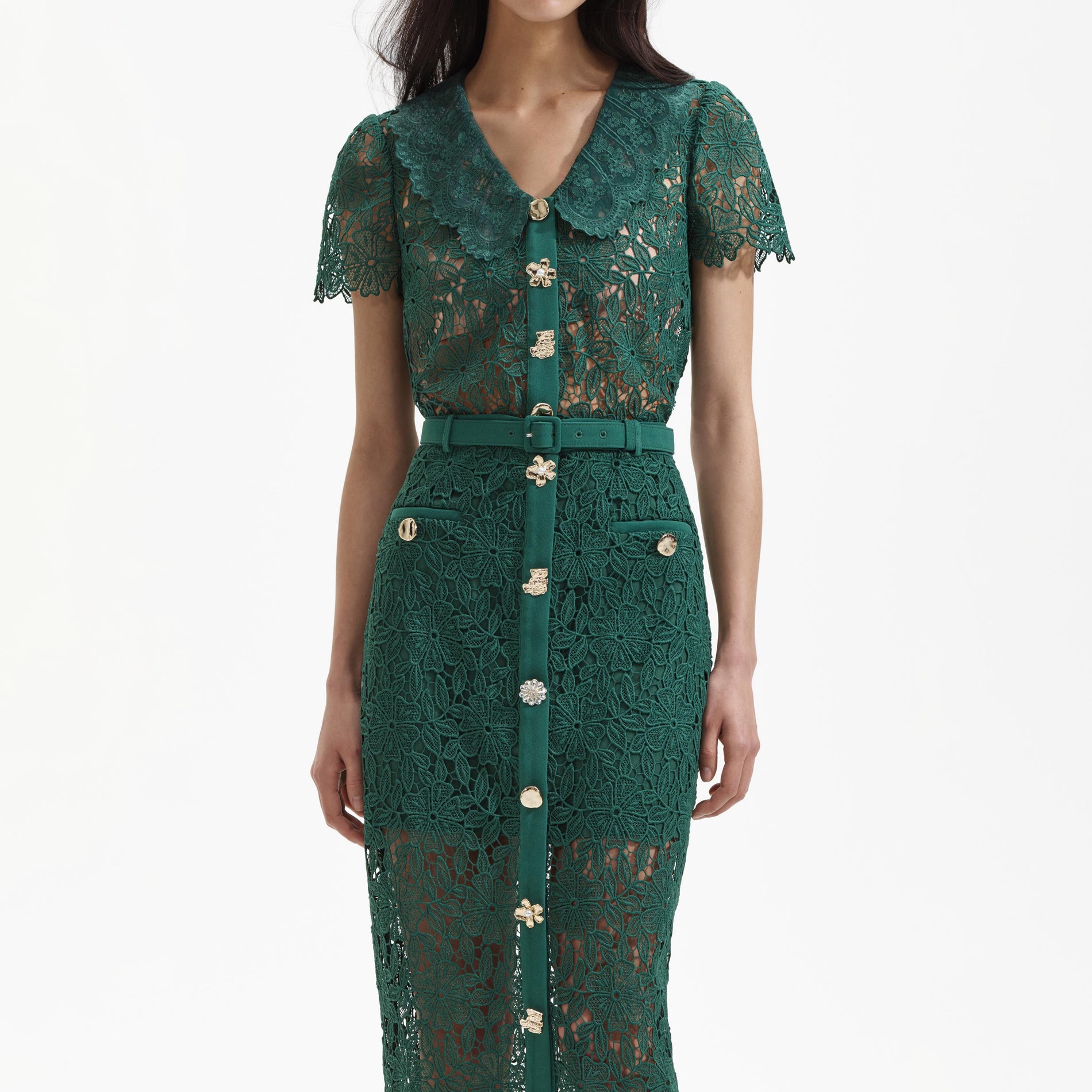 A close up of a woman wearing the Green Guipure Lace Midi Skirt