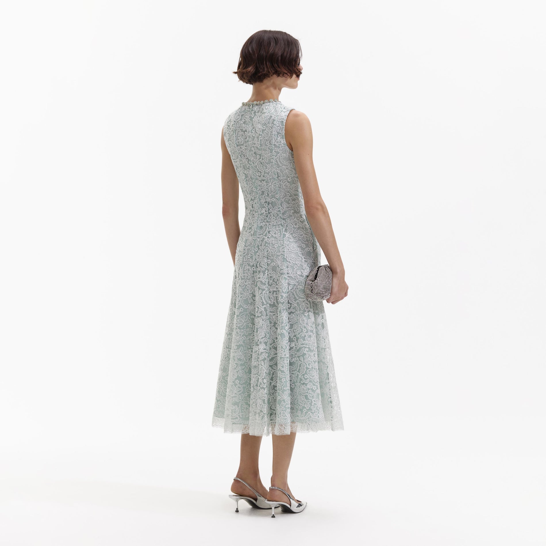 Back view of a woman wearing the Green Cord Lace Round Neck Midi Dress