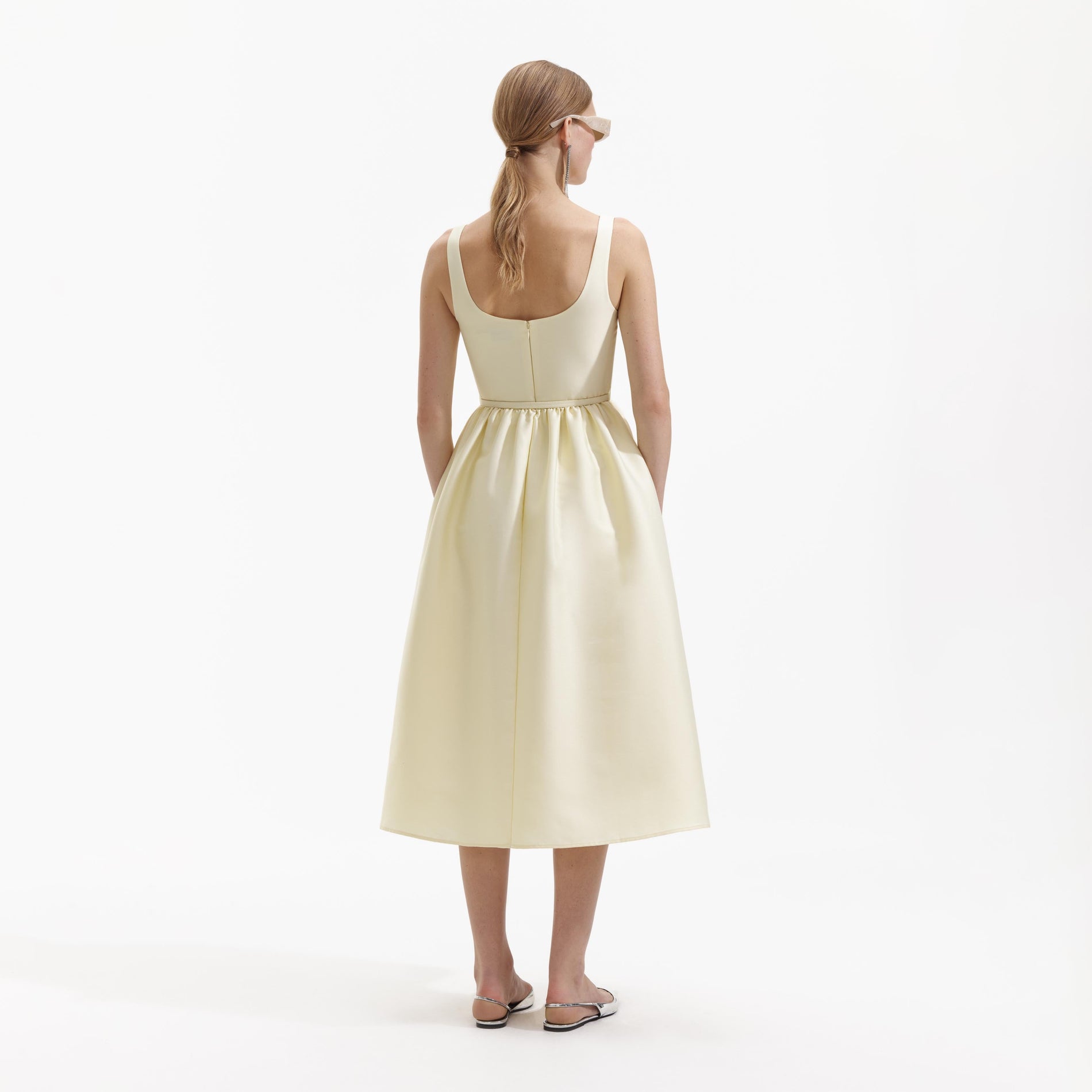 Back view of a woman wearing the Yellow Taffeta Midi Dress