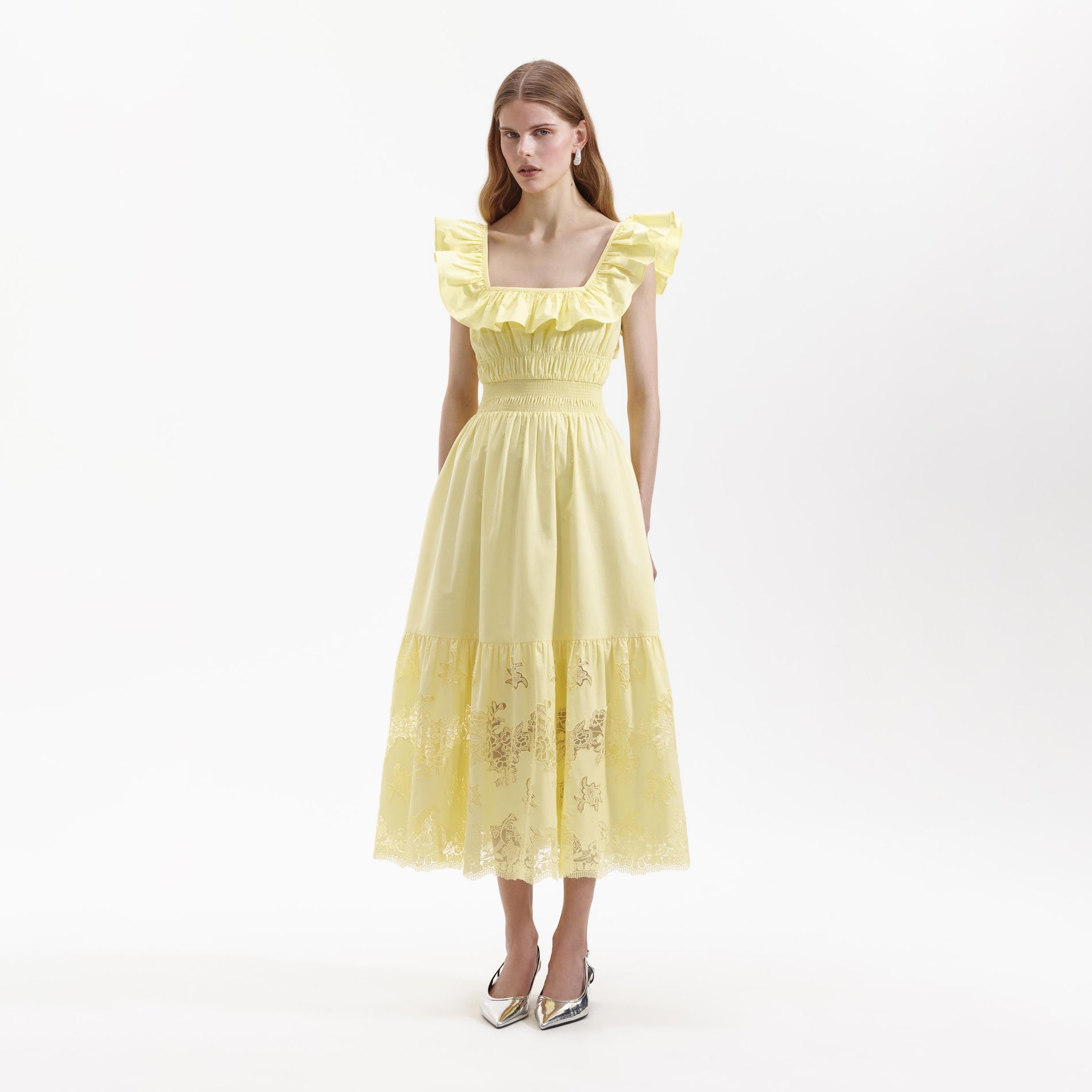Side view of a woman wearing the Yellow Cotton Midi Dress