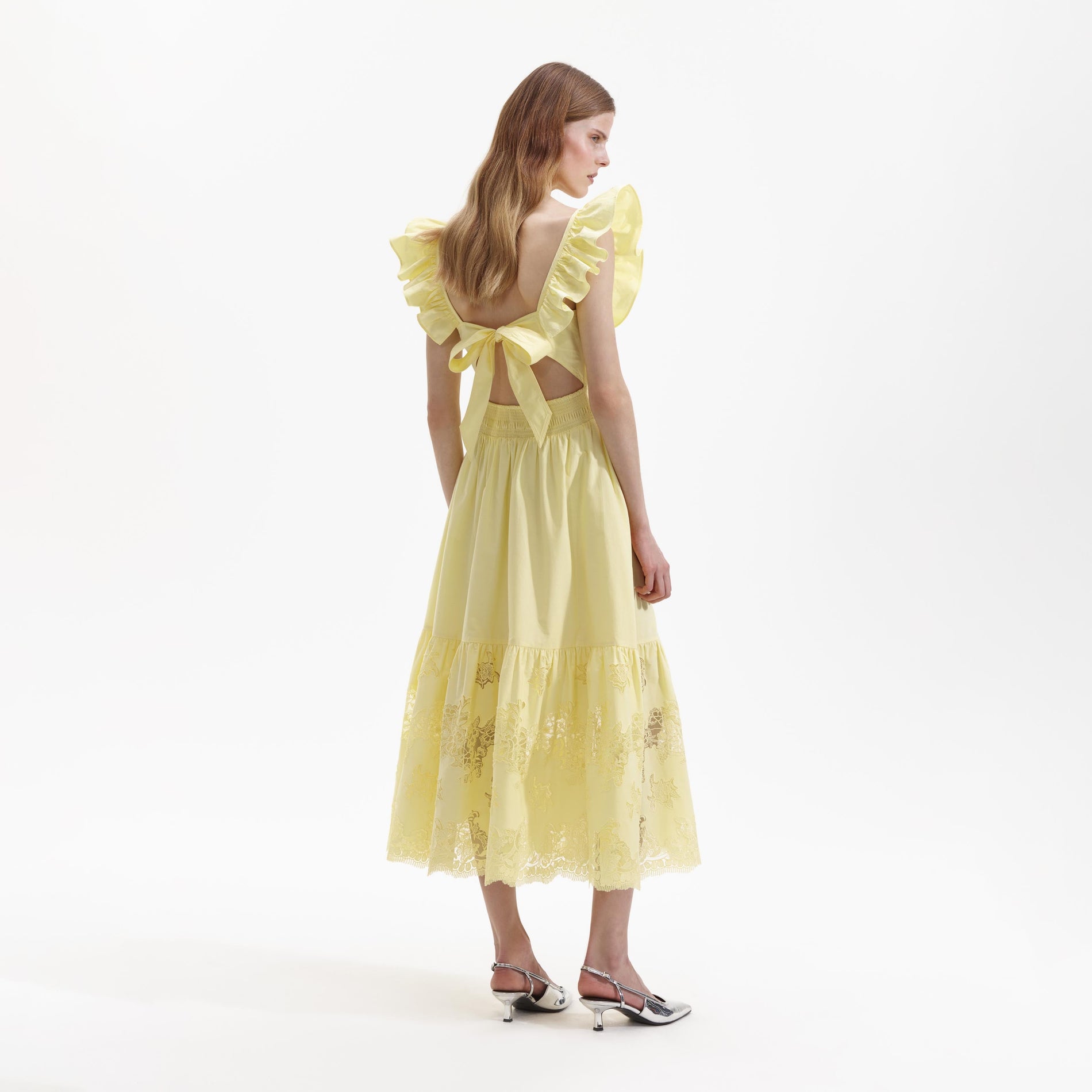 Back view of a woman wearing the Yellow Cotton Midi Dress