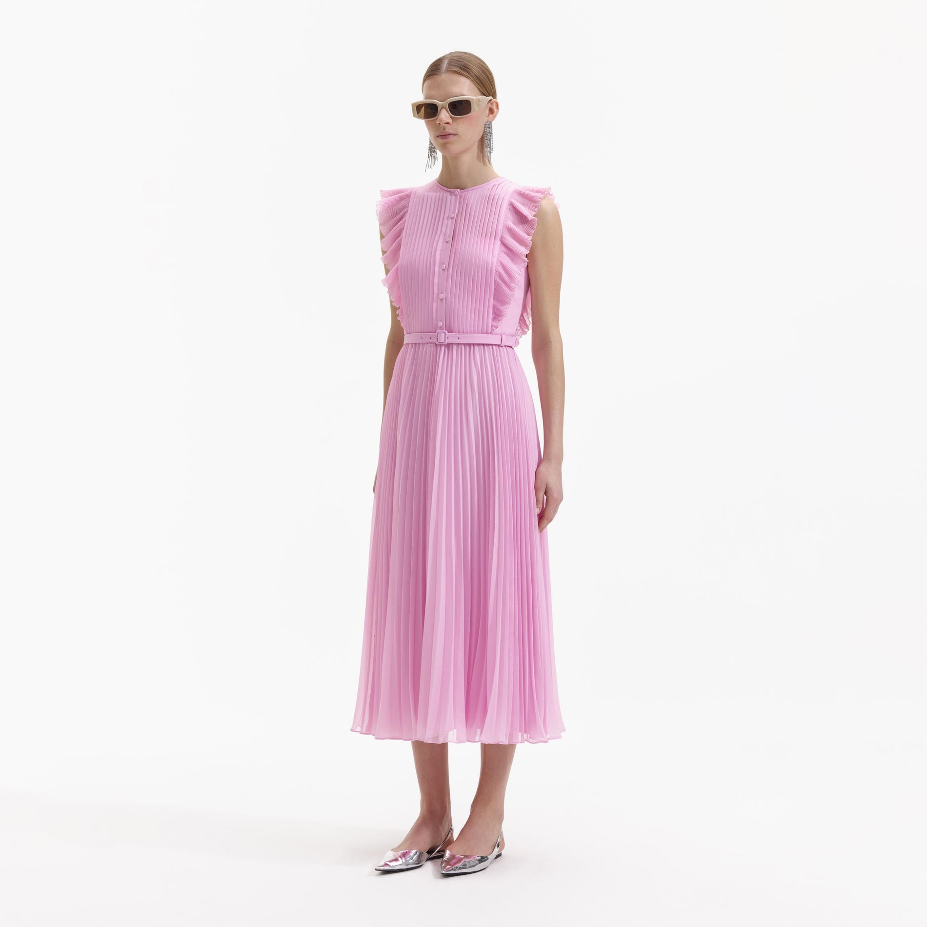 Side view of a woman wearing the Pink Chiffon Tunic Midi Dress