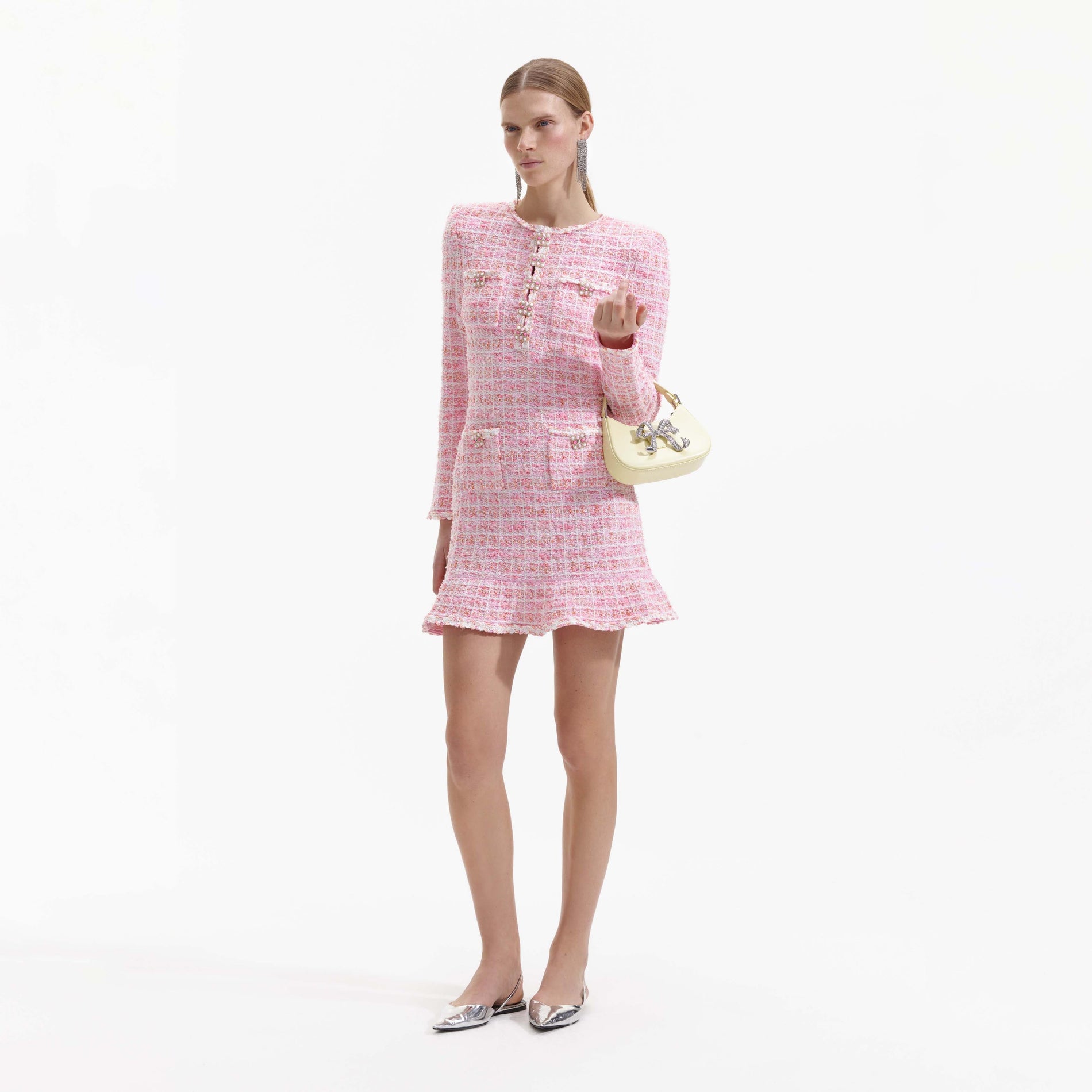 Side view of a woman wearing the Pink Check Knit Mini Dress