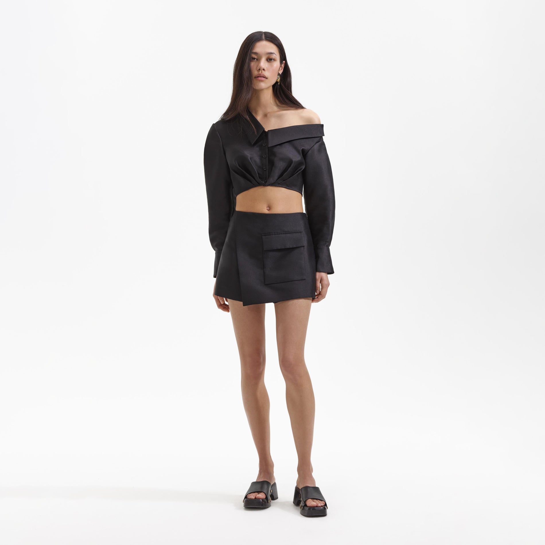 Front view of a woman wearing the Black Taffeta Skort