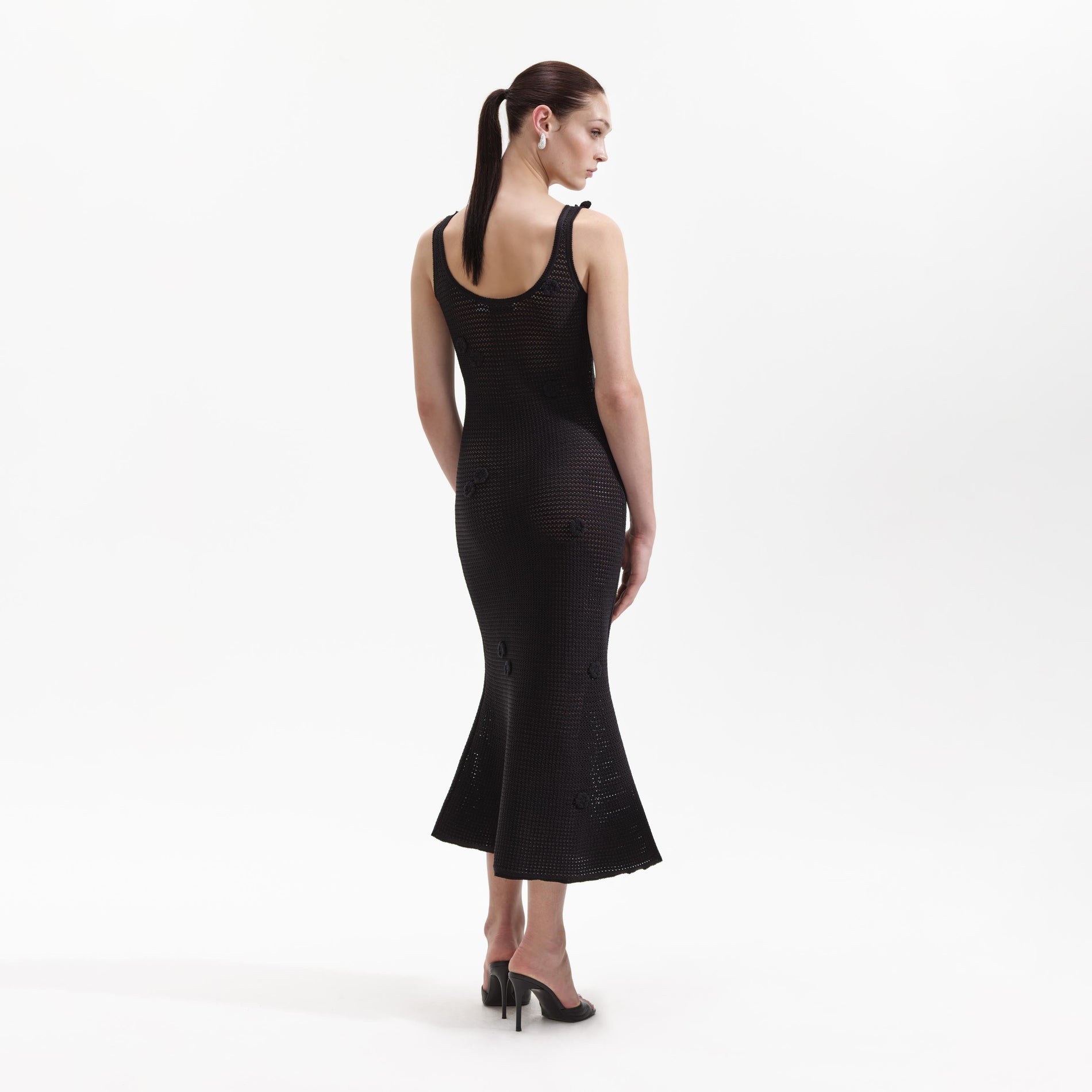 Back view of a woman wearing the Black Crochet Midi Dress
