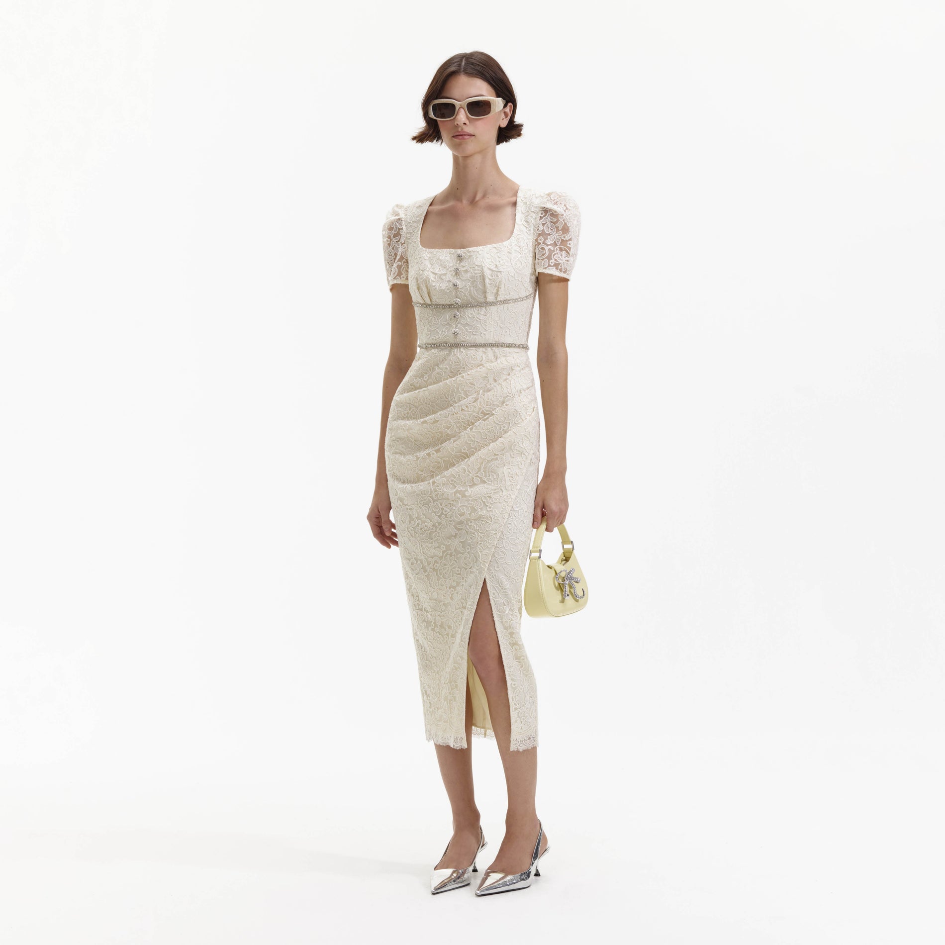 Side view of a woman wearing the Cream Lace Diamante Midi Dress