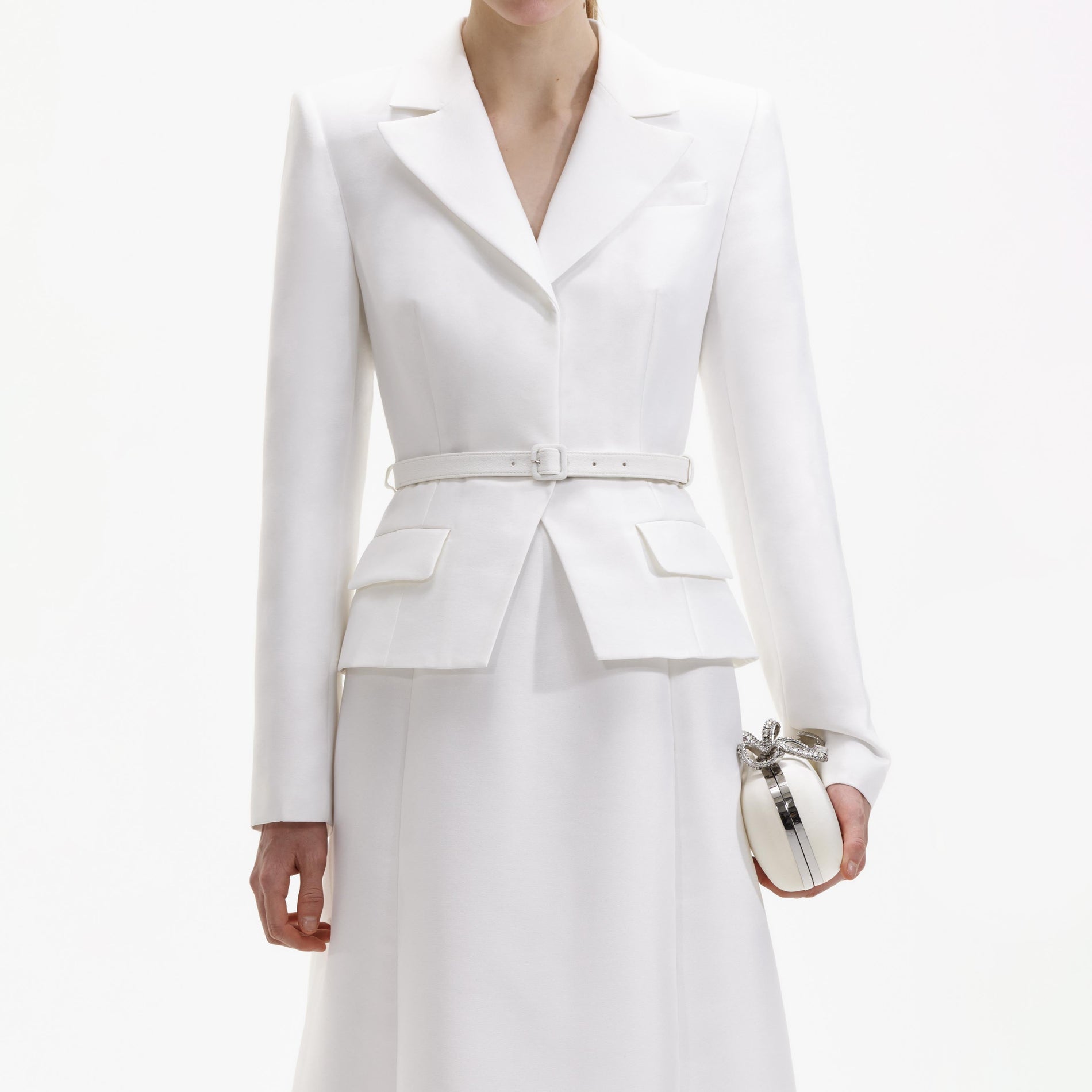 A close up of a woman wearing the White Tailored Taffeta Midi Dress