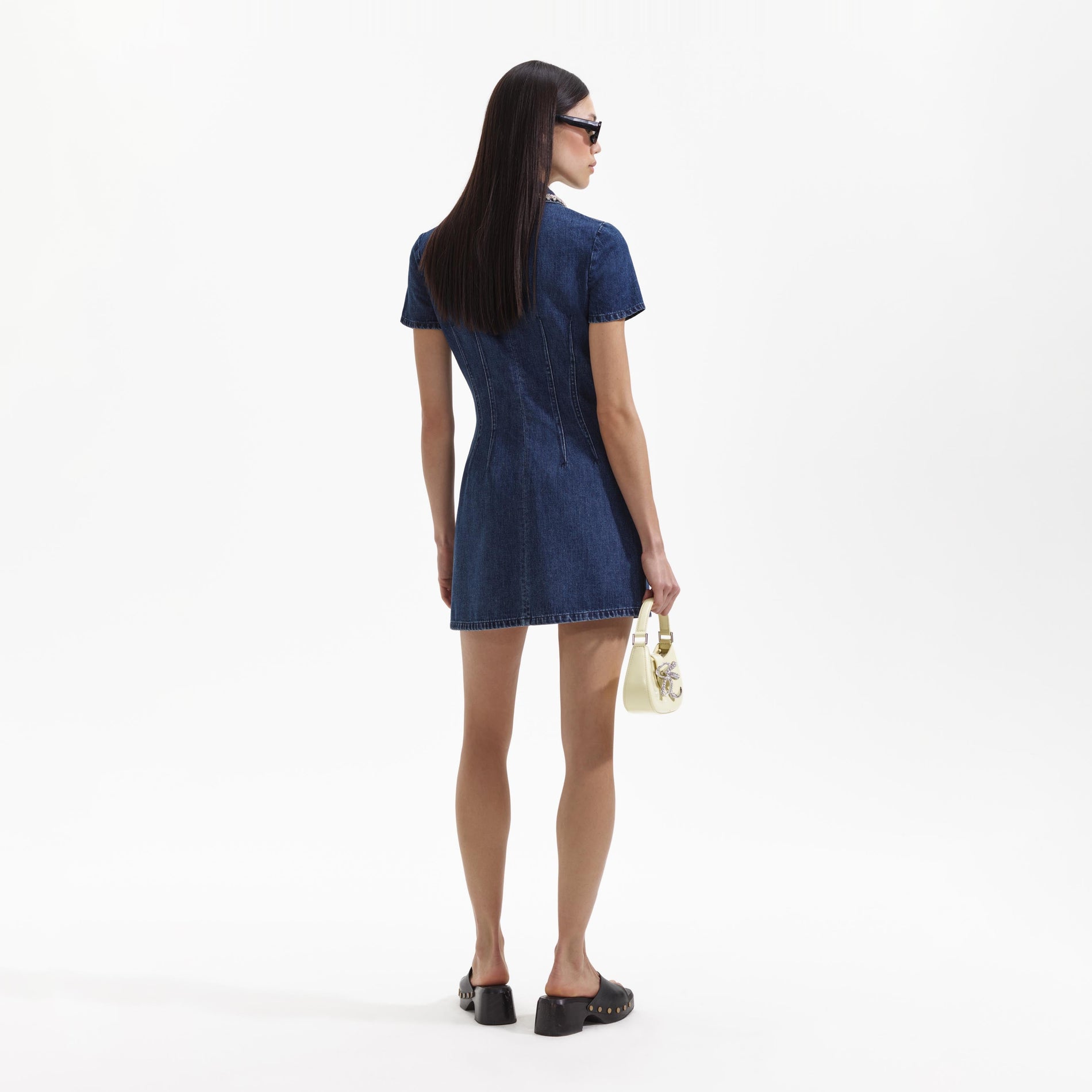 A Woman wearing the Denim Collared Mini Dress
