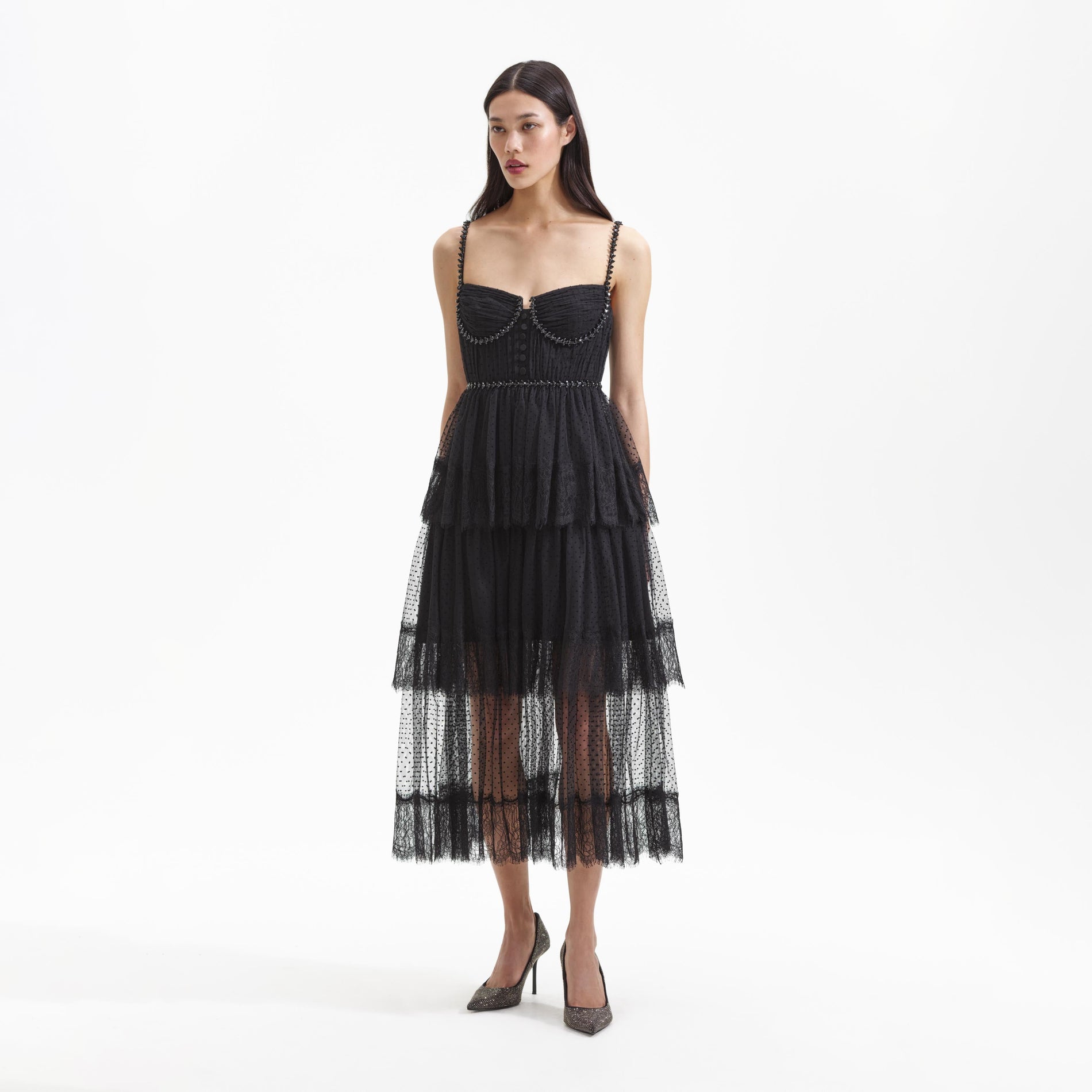 Side view of a woman wearing the Black Dot Mesh Tier Midi Dress