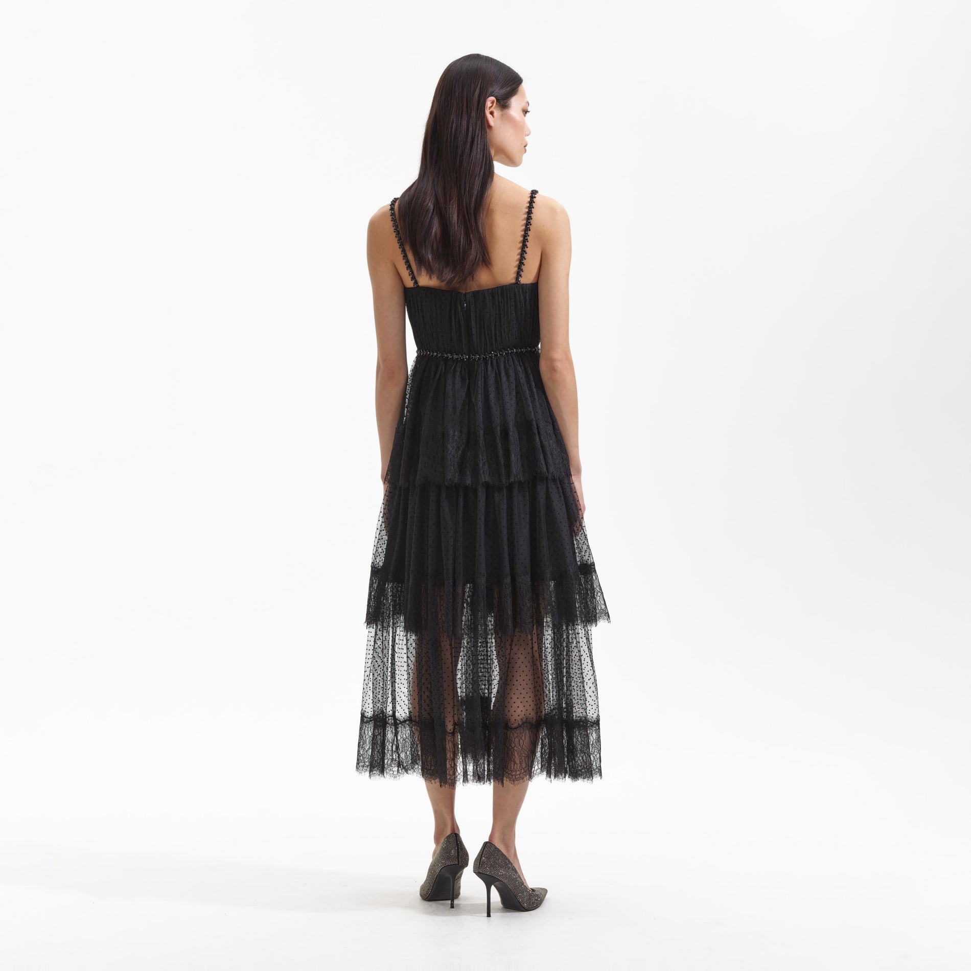 Back view of a woman wearing the Black Dot Mesh Tier Midi Dress