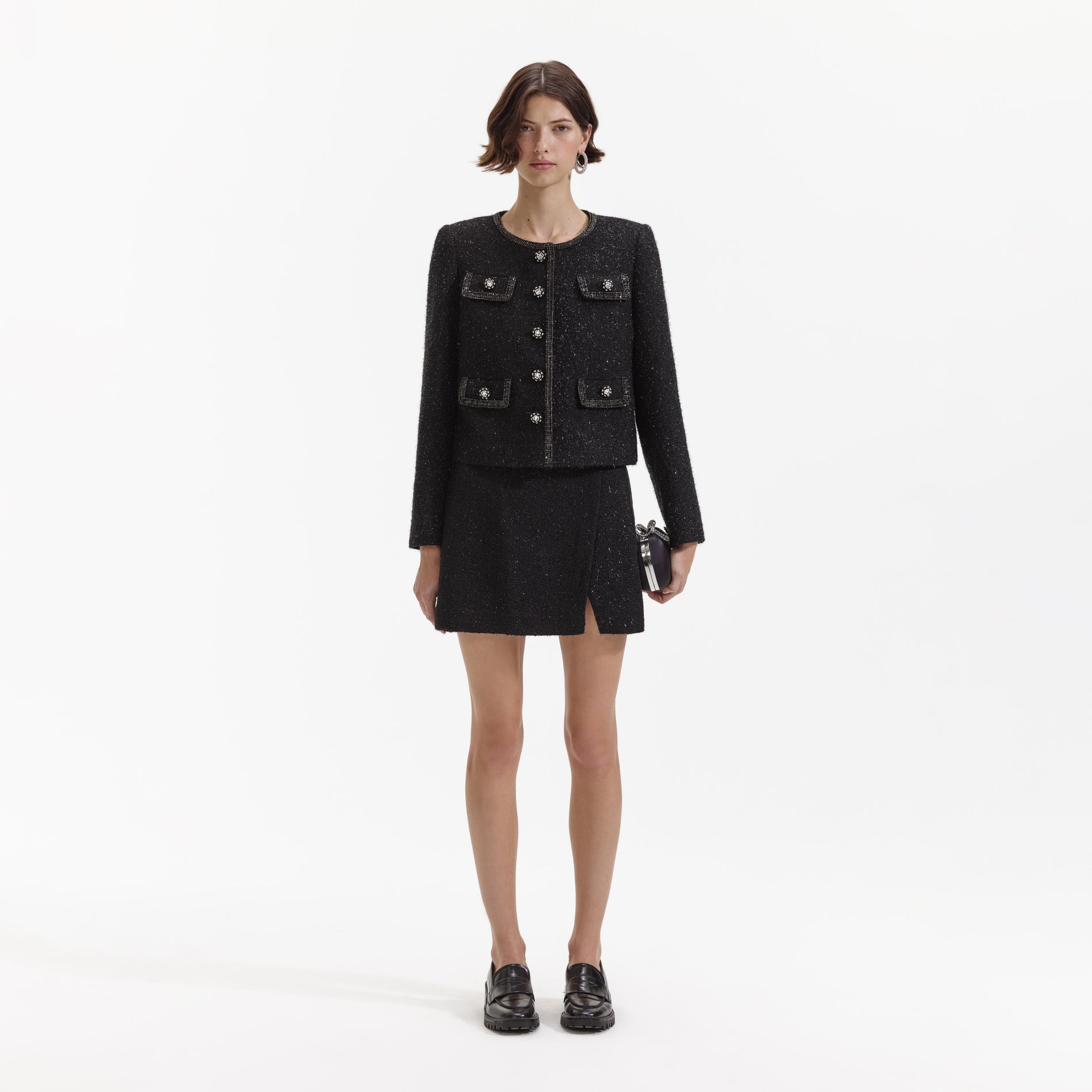 Front view of a woman wearing the Black Boucle Trimmed Jacket