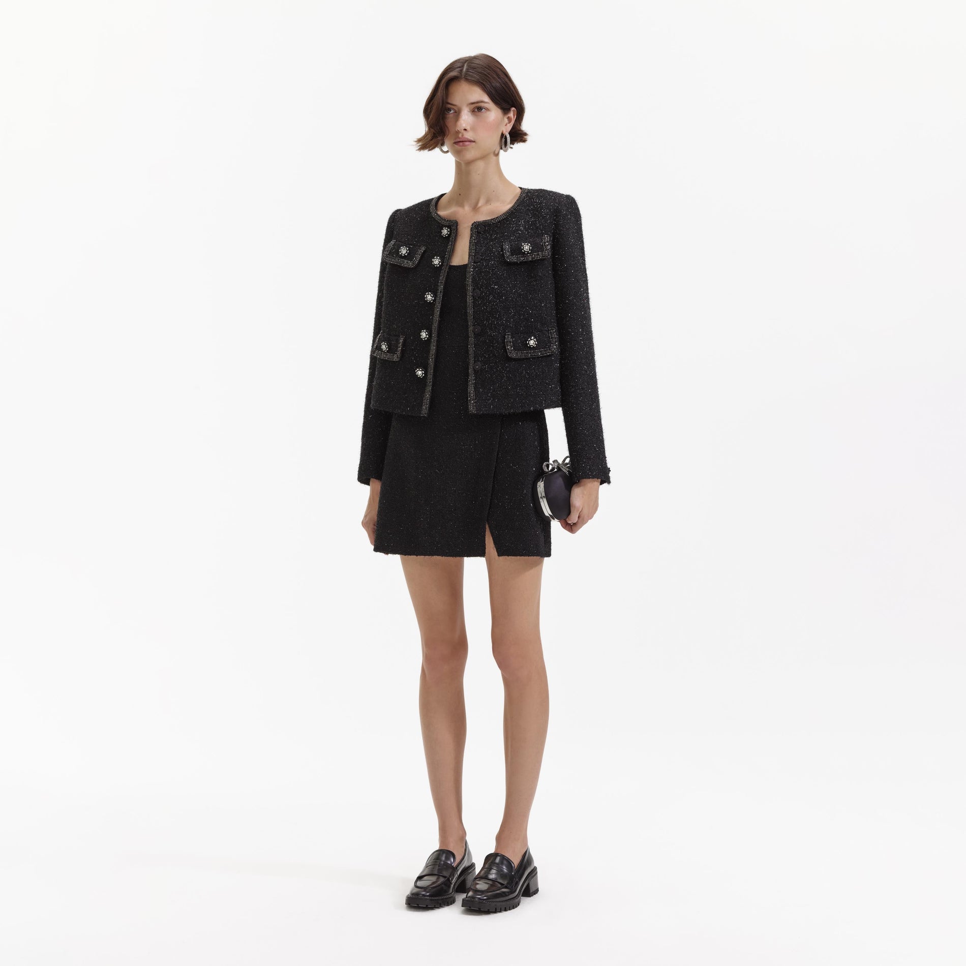 Back view of a woman wearing the Black Boucle Trimmed Jacket