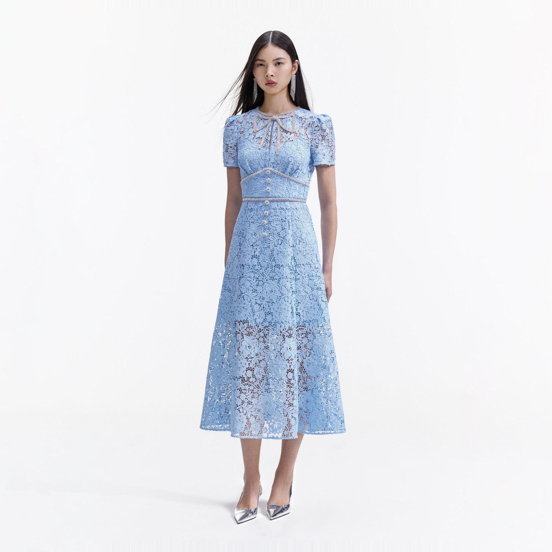 Side view of a woman wearing the Blue Cord Lace Bow Midi Dress