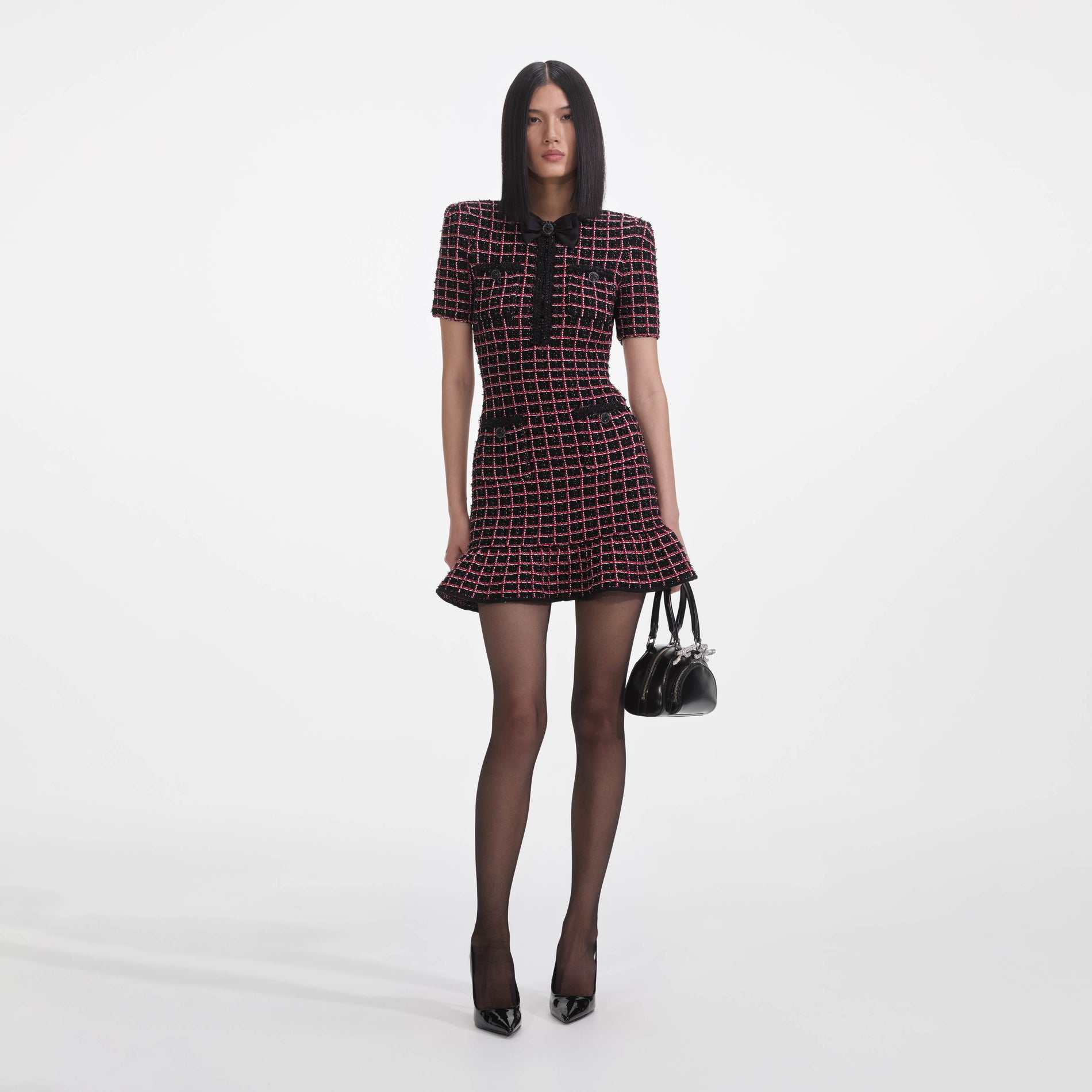 Front view of a woman wearing the Black And Red Check Knit Mini Dress