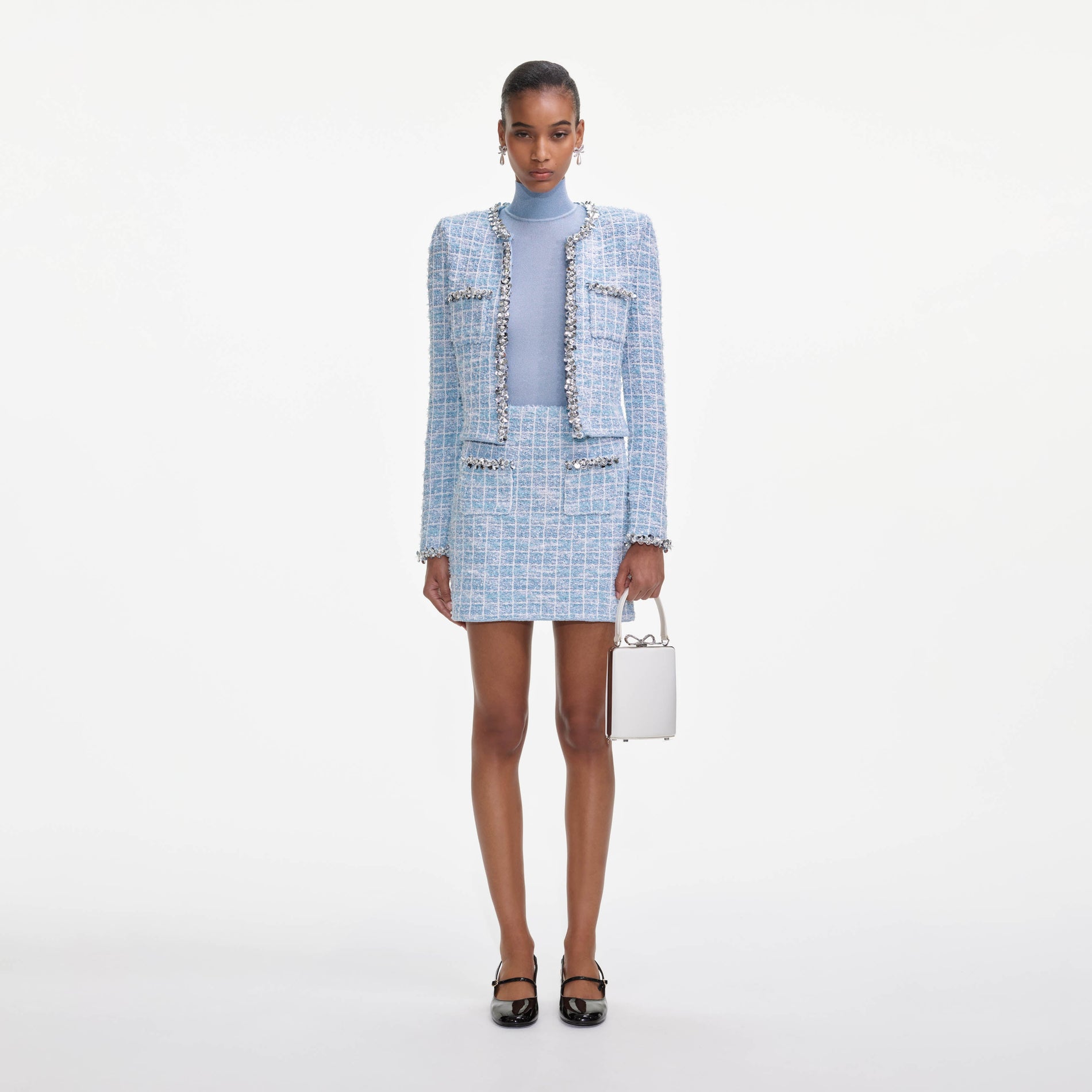 Front view of a woman wearing the Blue Check Knit Mini Skirt