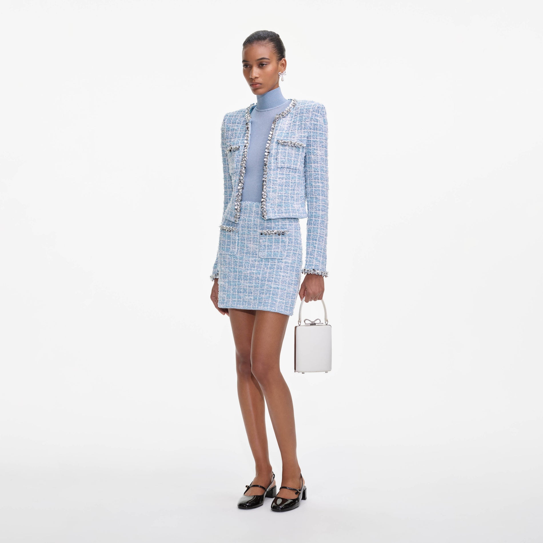 Side view of a woman wearing the Blue Check Cardigan