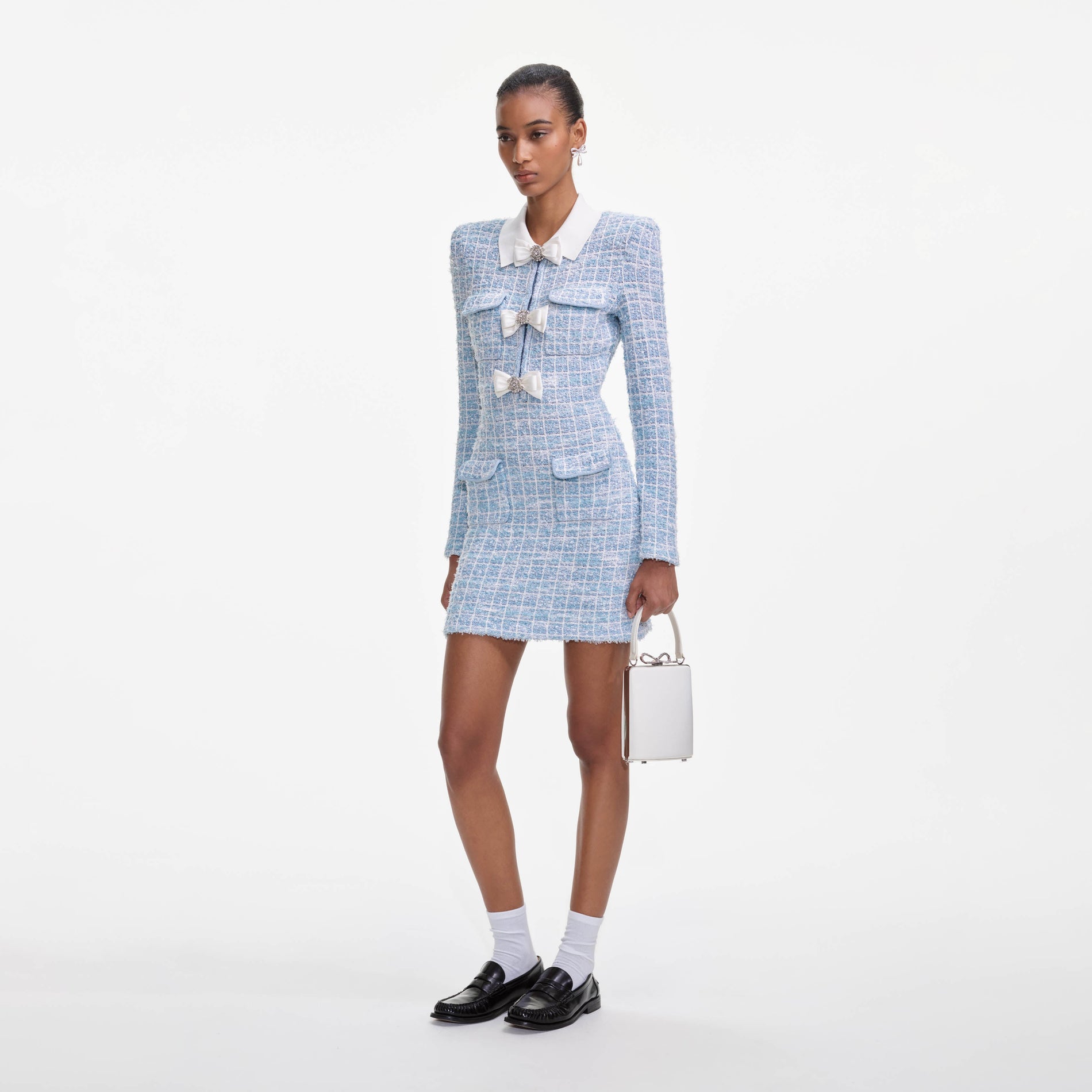 Side view of a woman wearing the Blue Check Collared Knit Mini Dress