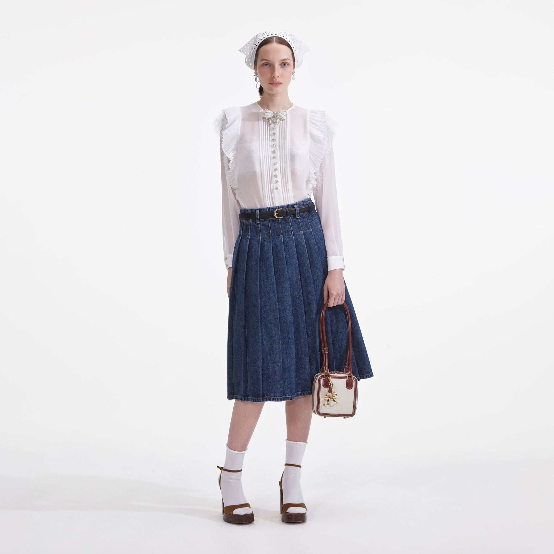 Front view of a woman wearing the White Chiffon Ruffle Top