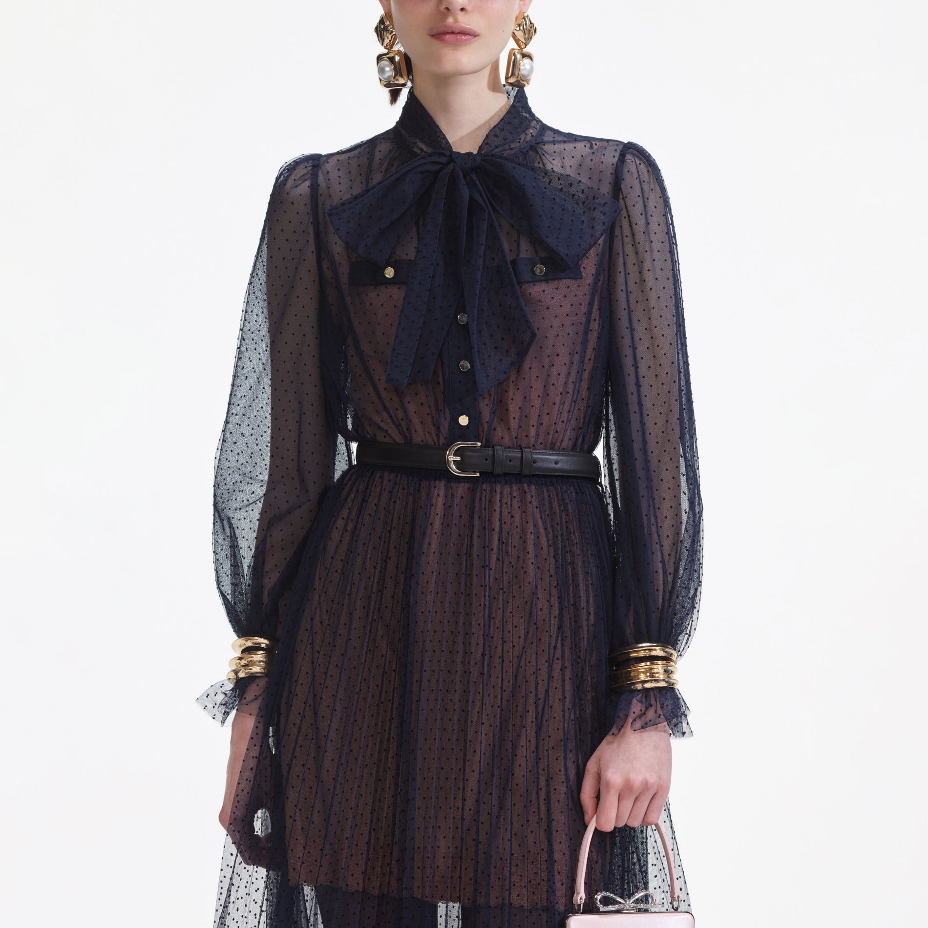 A close up of a woman wearing the Navy Dot Mesh Midi Dress