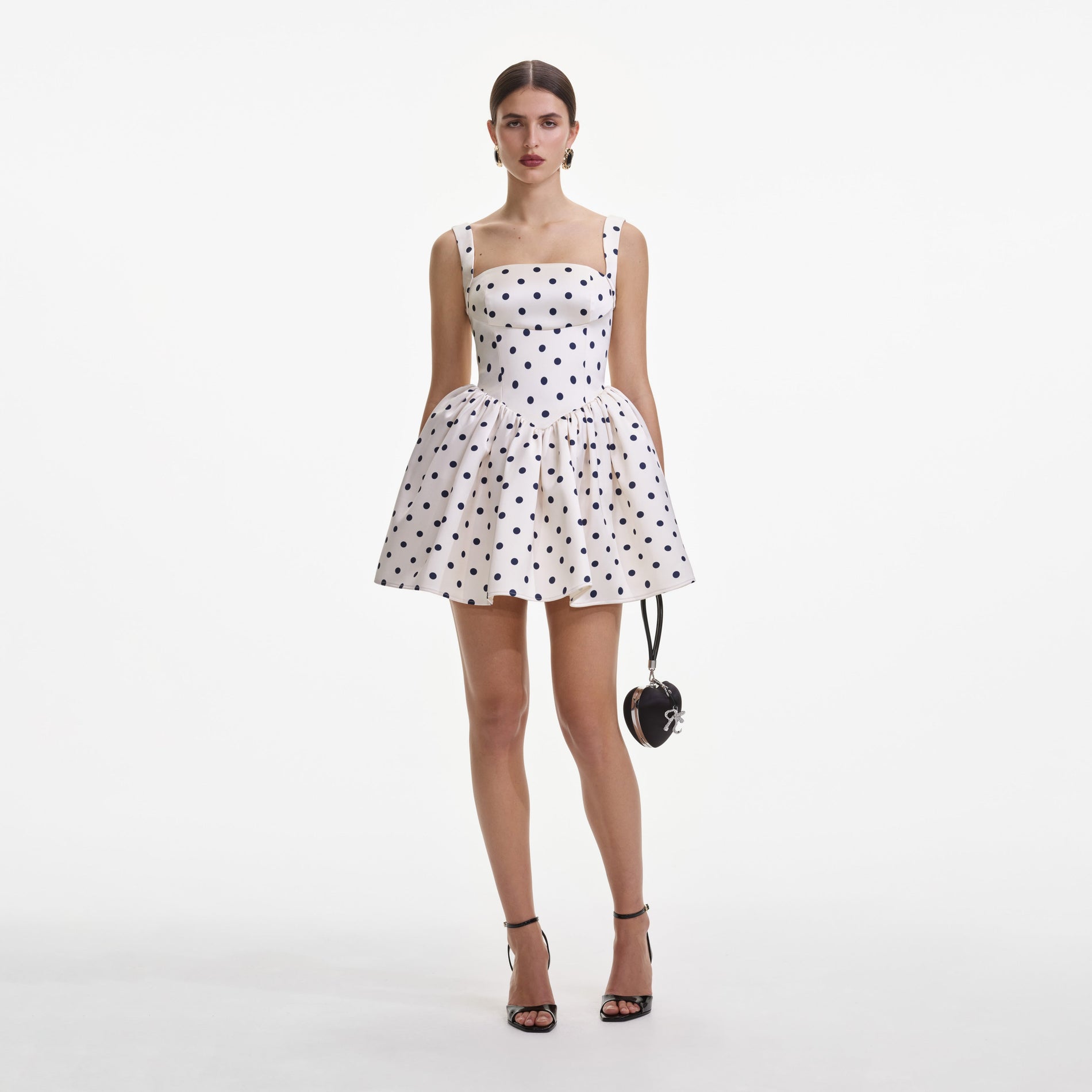 Front view of a woman wearing the Cream Polka Dot Satin Mini Dress